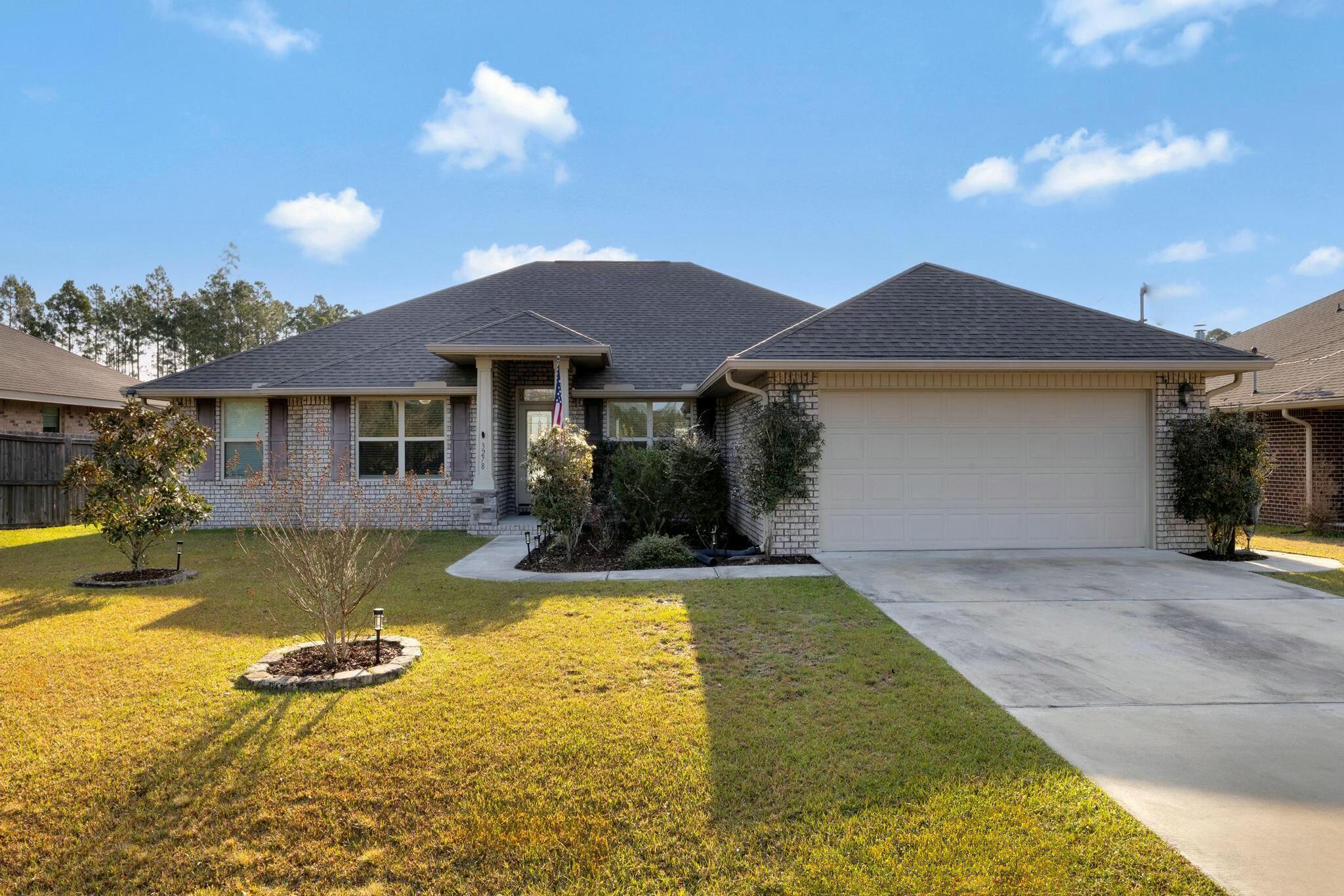 *ASSUMABLE LOAN 2.25%* Discover this 4-bedroom, 2-bathroom home in Navarre, FL, featuring a fully paid-off solar panel system that delivers an average electric bill of just $26 per month, with 20 years remaining on the warranty. This energy-efficient upgrade reduces utility costs and adds significant long-term value, making it a standout benefit for buyers and a key consideration for appraisers.Located in an area with no HOA restrictions, this property offers flexibility and appeal. The split floor plan is designed for privacy and practicality, with the primary suite separated from the three additional bedrooms. The primary suite includes a spacious layout and an ensuite bathroom with granite countertops, while the other bedrooms provide ample space for family, guests, or a home office. The open-concept kitchen, equipped with granite countertops, connects directly to the living area, offering a functional and appealing space for daily living. Granite finishes extend to the bathrooms, adding consistency and durability throughout. The home also includes a formal dining room and a separate flex room, which can serve as an office, playroom, or additional living space based on your needs.
Outside, a large screened-in porch provides a comfortable area for year-round use, leading to a fully privacy-fenced backyard suitable for relaxation or activities. The property features a well for the sprinkler system and gutters for efficient maintenance. Inside, upgrades include an epoxy-coated garage floor, an AO Smith Signature Premier Hybrid Water Heater, ceiling fans in multiple rooms, and vinyl blinds throughout.
Public boat ramp access is available less than a mile away off Live Oak Street, a convenient feature for water enthusiasts. The stained privacy fence enhances the backyard's appeal, and the absence of HOA fees offers added freedom. Additional highlights include a sprinkler system well and proximity to local amenities.
This Navarre home combines energy-saving features, quality finishes, and a practical layout. Schedule a showing today to see the value and potential this property offers.