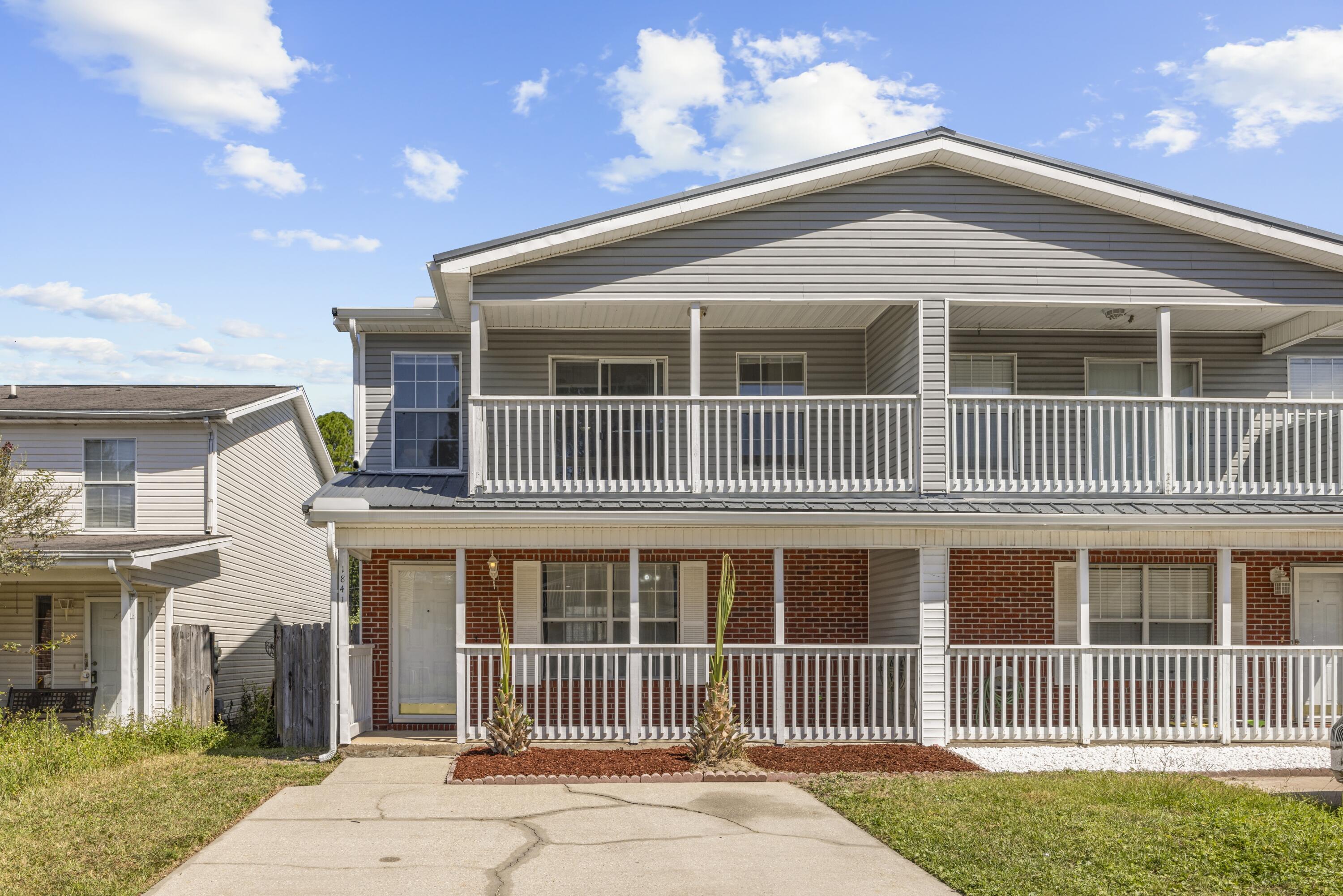 NEWER METAL ROOF (2021) & WATER HEATER (2023)! Welcome to 1841 Pointed Leaf Lane, an impeccably maintained 3-bedroom, 2.5-bath townhome located in the heart of Fort Walton Beach, ideally situated between Eglin AFB and Hurlburt Field. This spacious home features luxury vinyl plank (LVP) flooring throughout, offering durability and modern appeal. The galley-style kitchen features granite countertops, a breakfast bar, ample cabinet space, and a pantry closet. A designated dining area flows seamlessly into the bright living space, enhanced by ample natural light and a comfortable, open layout. Downstairs also includes a convenient half-bath and a laundry closet. Upstairs, the primary suite includes a trey ceiling, ceiling fan, and a private balcony to enjoy the Florida breeze. The attached en-suite features a double vanity with granite countertops and a large walk-in closet. Outside, enjoy a covered front porch, open back patio, and a privacy-fenced backyard. With major updates already complete and a central location near bases, beaches, and amenities, this move-in-ready property is ready for your private showing today!