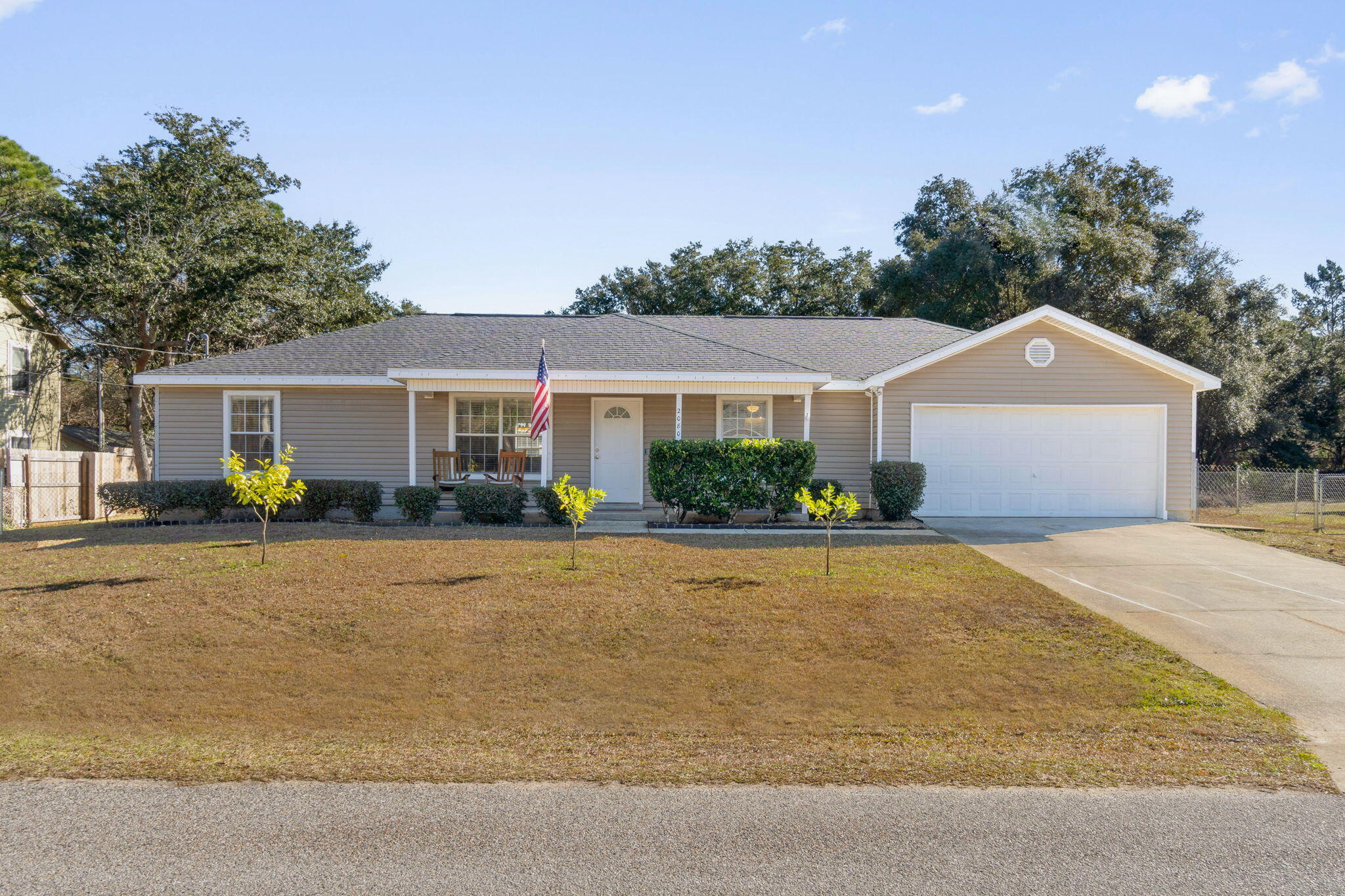 *Roof and water heater brand new in 2023!* Welcome home to this perfectly located Navarre home on a sprawling 0.41 acre lot perfect for your new home or investment property featuring 3 bedrooms plus a bonus room! Pull into the driveway and you'll find a well cared for home and tasteful landscaping with an inviting front porch. Step inside to find a split floor plan with a nice open living room to the dining room space and vaulted ceilings that open up the space! The kitchen features tile flooring and pantry, and it overlooks the spacious backyard! On the other side of the kitchen is an oversized interior laundry room and also a bonus room! The owner's suite is a great space with a walk in closet and updated en suite bathroom! The other two nice sized bedrooms are on the other