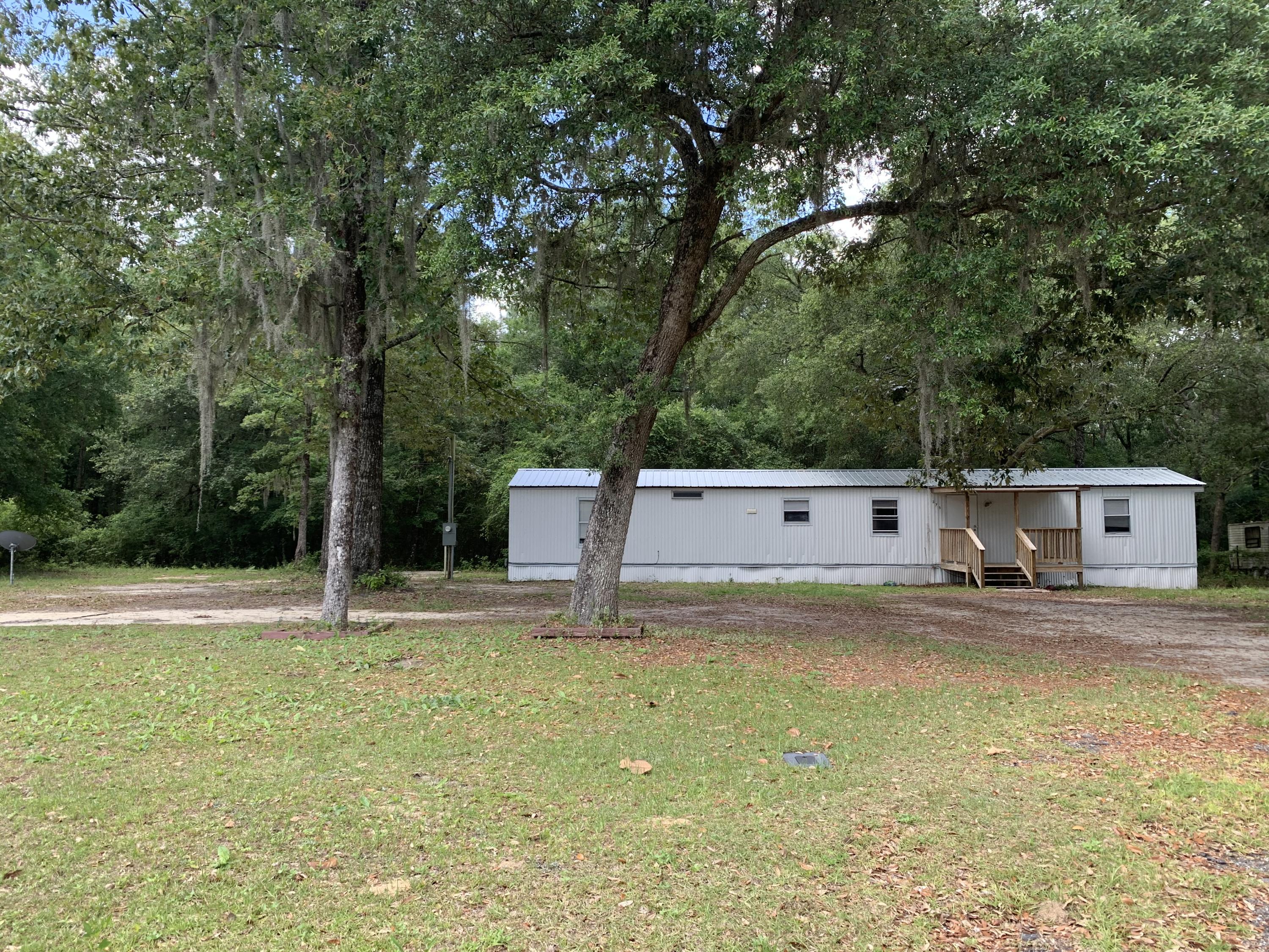 This 2 Bedroom 2 Bath home sits on 2 lots totaling a little over half an acre. The bedrooms are oversized with nice size closets in each of them. It has a beautiful yard with large trees that provide plenty of shade & the front & back porches are covered. In 2016 the metal roof was put on and the HVAC unit was also installed at that time.