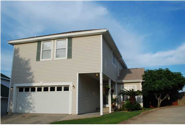 BEAUTIFUL CUSTOM HOME LOCATED IN THE HEART OF DESTIN. SPACIOUS, WELL KEPT HOME WITH 9 FOOT CEILINGS, RECESSED LIGHTING, CEILING FANS THROUGHOUT. ISLAND KITCHEN, CUSTOM PICKLE CABINETS, AND BEAUTIFUL CUSTOM SPANISH TILE. WIRED FOR SURROUND SOUND AND SECURITY SYSTEM. VERY NEAT AND WELL KEPT FENCED BACK YARD WITH A PERGOLA, PATIO, PRODUCING GRAPEFRUIT TREE AND FIG TREE, AND JASMINE. THIS HOME IS A MUST SEE!