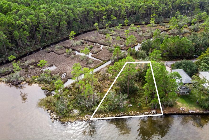 This beautiful homesite resides on 95 feet of the Choctawhatchee Bay. The property located at the end of Joy Lane, providing  quiet and privacy. Fishing, boating, kayaking and watching the sun rise right out your back yard.Along the shoreline is a concrete rip-rap  adding protection from erosion. The existing footprint of a  160 foot long dock will add value and  create a peaceful recreational area. NO HOA & NO BUILD OUT TIME. A new boundary survey and wetland delineation are scheduled.  Come build your dream home, relax and Enjoy.***Buyer is responsible for personally verifying details about this property.  Any information contained in this listing is believed to be accurate but is not guaranteed.***