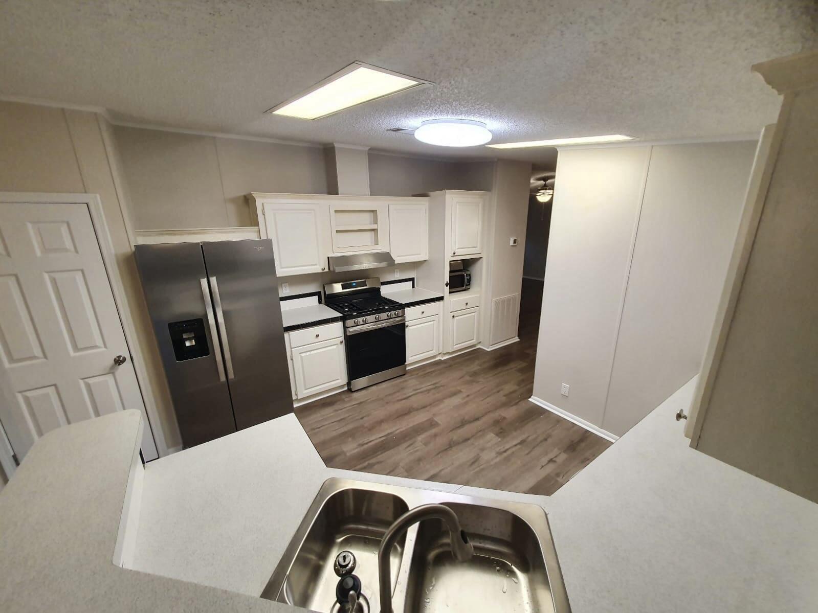 Grab it Quick! VA, Conventional financing okay!! or cash. 2021 Ac 2022 Roof -55k put into rehab.. Stainless Steel appliances  Affordable Manufactured home in the heart of Niceville.  located in a Mobile home park that also has a community pool and waterfront lake access.  Home has new interior paint, flooring (laminate in living areas and carpet in bedrooms) lighting.  This adorable home has two living areas Living Room with Fireplace and family room.  Formal dining room and eat-in kitchen as well.  Split bedroom design.  Master bedroom with bath is off family room.  Master bath features a garden tub and separate shower as well as double vanities.  A carport that will hold two cars.  There is also a screened porch off the kitchen for enjoying coffee in the morning or a glass of wine eve