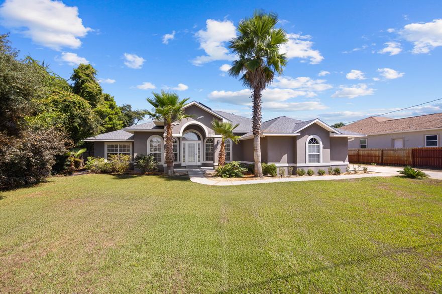 *Presented with staging furniture*Major Upgrades & Features:Brand new roof (June 2025)Septic tank leach field increased & lift station added (Sept 30th 2025)Lawn pump & pool pump replaced (2025)Entire interior freshly repainted (Sept 2025)HVAC replaced (2024)Solar panels added (2020)Pool & hot tub added (2019)Welcome to this beautifully upgraded 3-bedroom, 2-bath home perfectly located near Navarre Beach, popular dining, and shopping. Step inside to an inviting living area featuring high vaulted ceilings, a ceiling fan, and a striking corner fireplace with stone surround. The open-concept layout flows seamlessly into the kitchen and dining area, ideal for entertaining. Off the foyer, you'll find two versatile flex spaces, perfect for a formal dining room, home office, or family room. The kitchen boasts honey oak cabinetry offering ample storage, a pantry closet, sleek black stone countertops, and a wrap-around breakfast bar for casual dining. Retreat to the spacious primary suite with high tray ceilings and relaxing backyard views. The ensuite bath includes a double vanity, a sizeable walk-in closet (plus an additional step-in closet in the bedroom), a sauna, separate walk-in shower, and a garden tub. Enjoy your private backyard oasis complete with a screened patio and ceiling fan, raised deck with pergola-covered hot tub, mid-sized fiberglass saltwater pool, additional patio space, and a storage shed. This home combines thoughtful updates, modern amenities, and unbeatable location, truly a must-see Navarre gem!