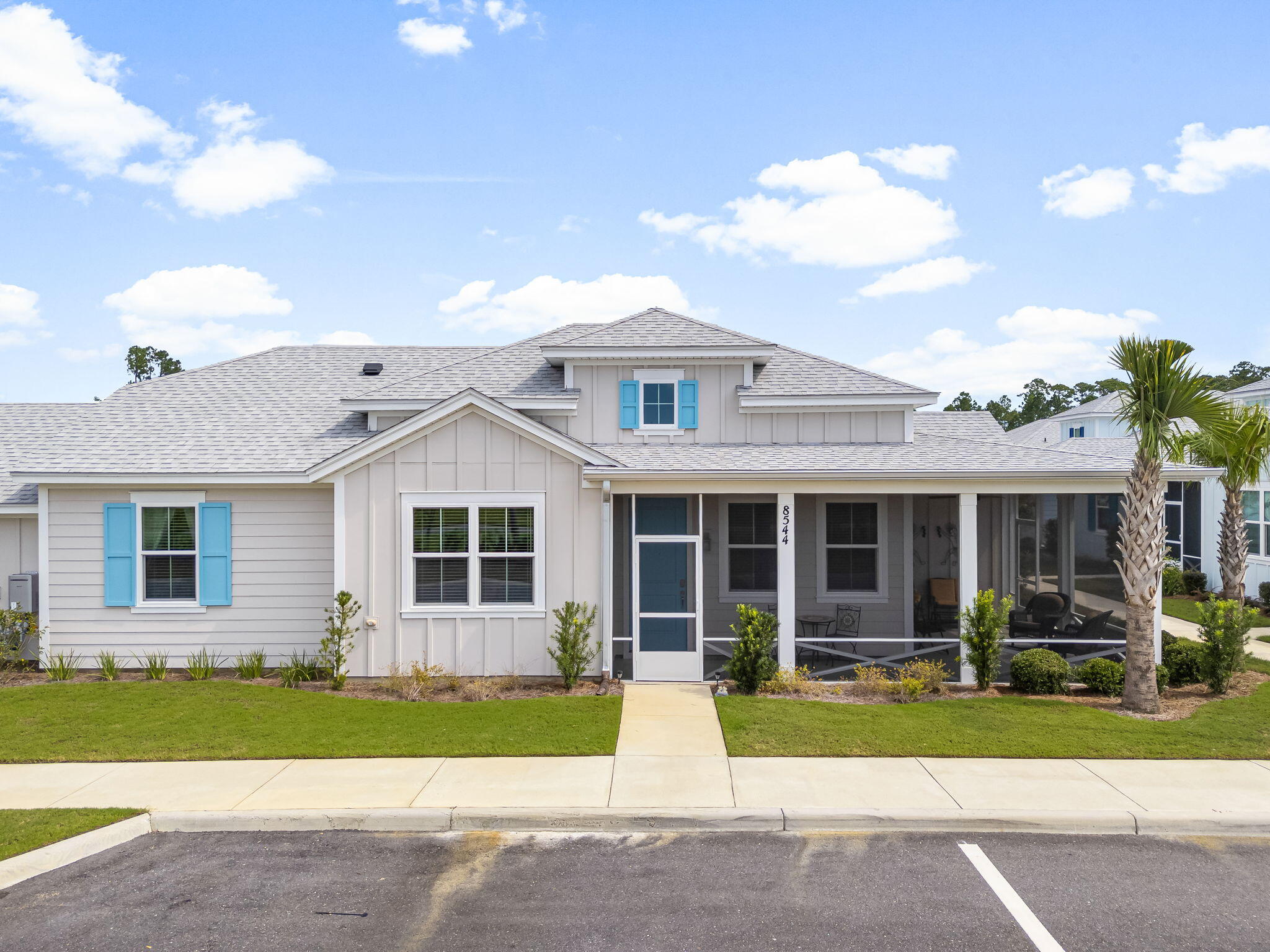 **Dreamsicle Cottage in Latitude Margaritaville Watersound** *Phase 5 - Just 7 Minutes from Town Center* Welcome to your dream retreat at Latitude Margaritaville Watersound, where life is a celebration and every day feels like a vacation! Nestled in the vibrant Phase 5 of this premier 55+ community, Dreamsicle Cottage offers the ideal blend of comfort, style, and convenience. **Key Features:** - **Prime Location**: Enjoy the best of both worlds with a street-facing home just 7 minutes from the bustling Town Center. Easily access shopping, dining, and entertainment while still enjoying the peace and tranquility of your own slice of paradise. - **Outdoor Oasis**: Sip your morning coffee as the sun rises and unwind with a glass of wine as the sun sets on your expansive screened and epoxy porch. This private outdoor space invites you to soak in the fresh air while being surrounded by the natural beauty of the community. - **Modern Convenience**: Step inside and be greeted by a warm, inviting atmosphere devoid of carpet, making maintenance a breeze. A custom built-in Bookshelf just off the kitchen adds cottage charm for all your reading and decor. The elegant laminate flooring not only enhances the home's aesthetic but also ensures durability, perfect for an active lifestyle. - **Chef's Paradise**: The heart of the home features stunning granite countertops paired with custom island-style cabinetry, perfect for cooking enthusiasts and entertainers alike. The thoughtful addition of custom pull-out drawers in EVERY lower cabinet ensures everything is organized and easily accessible. **Primary Suite**: If you enjoy organization, the custom built in closet is pure heaven coupled with custom pull out shelves under each cabinet sink that provide easy access to all your beauty items! - **Garage Excellence**: Your garage isn't just a space for your car; it's a polished and functional area with epoxy flooring that adds a touch of sophistication and practicality. **Community Highlights:** Living in Latitude Margaritaville Watersound means embracing a lifestyle filled with opportunities for connection, recreation, and relaxation. Take advantage of the close proximity to the golf cart tunnel, explore scenic walking trails, or gather with neighbors for community events. Engage in various activities designed to enrich your retirement years, all while surrounded by like-minded residents who value fun and fulfillment. **Why You'll Love It Here**: This is more than just a house; it's a lifestyle. Imagine leisurely strolls in the picturesque community, laughter-filled gatherings with friends, and the freedom to live life on your terms. With this Dreamsicle Cottage, you really can have it all! **Don't Miss Out!** This enchanting home is waiting for you to turn the key and start your next adventure. Whether you're ready to downsize or seeking the vibrant lifestyle that comes with a 55+ community, this Dreamsicle Cottage is the perfect place to call home. Schedule your private tour today and experience firsthand all the joy and comfort this property has to offer!