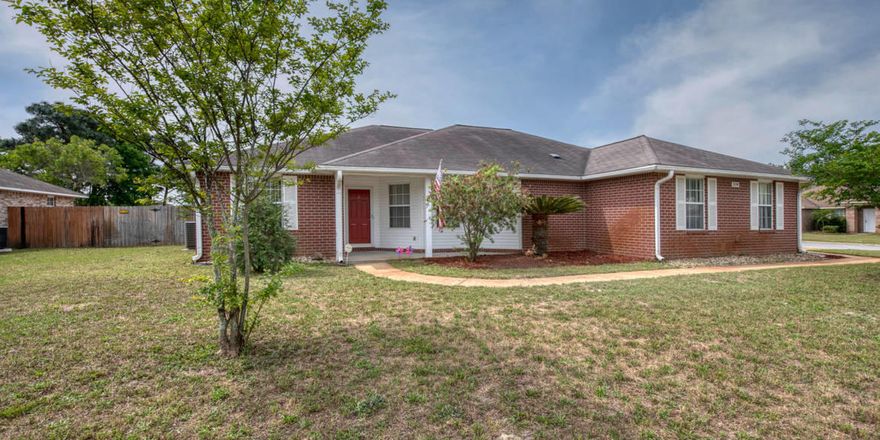 This beautiful 3 bed/2 bath home is located on a corner lot with great curb appeal. The side entry and garage take you along the sidewalk to the front entrance, where there is also a porch perfect for seating. When you walk in, the foyer leads to the great room with ledges for plants. The vaulted ceilings give this area a very spacious feel and the fireplace gives it warmth. Throughout the great room and formal dining room there is wood laminate flooring, while the kitchen and bathrooms have tile. The kitchen has a large pantry, wood cabinets, an island for food prep, and a breakfast nook. Overlooking the great room is the wet bar. The master suit features a garden bath, separate shower, double vanities, and a large walk in closet. See more details...