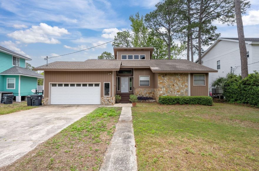 Hard to find 3BD 2BA home nestled on the banks of Buck Bayou, offering picturesque views and direct water access leading to Choctawhatchee Bay. Enjoy a private dock with boat lift--perfect for boaters--with quick access to North Beach and approximately 25 minutes by water to Crab Island. The home features a spacious living room with a full wall of windows, allowing for stunning water views and abundant natural light. Nearly every room in the house, including the primary suite, enjoys bayou views. The primary suite also includes two closets for ample storage. Interior highlights include vaulted ceilings, a large formal entryway, granite countertops in the kitchen, and updated bathrooms. The kitchen flows into a good-sized dining room that opens seamlessly into the living area.
