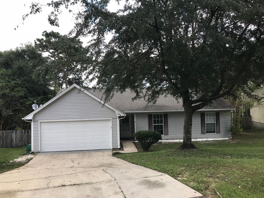 Fantastic Home South of I-10 off of John King Road. This home has a huge fenced in backyard that overlooks your very own stocked pond with a four level deck! You can sit out on your deck and listen to the birds, the wildlife and the beavers in the pond. The home has BRAND NEW carpet throughout the home that has not even been walked on yet! The rooms are freshly painted and the bathrooms and the foyer has newer tile. The 3 bedrooms each have walk-in closets and the Great Room has a vaulted ceiling with a beam. The Master Bathroom has a beam and a skylight! The wood-burning fireplace keeps the home warm in the winter time. Home comes with a refrigerator, gas stove, brand new hood vent, and a dishwasher. The roof and furnace are less than 8 years old. Come see this home today!!