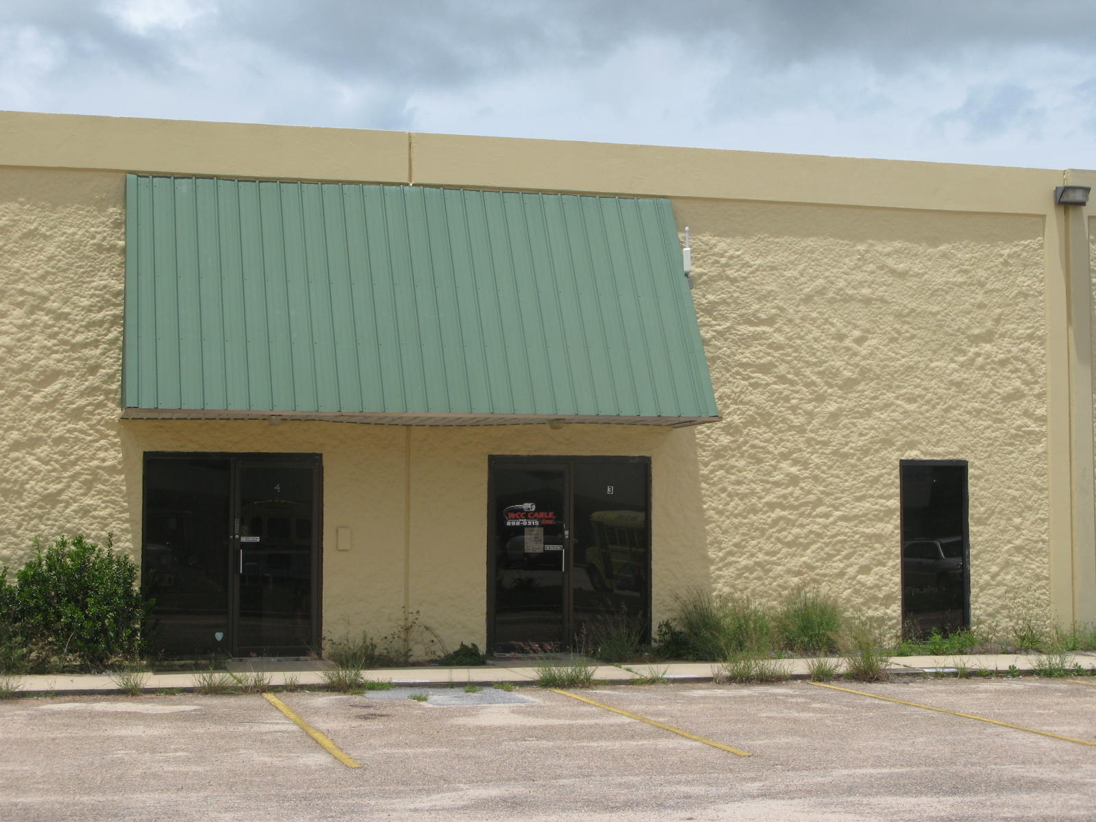 Has 2 offices, 1 restroom, balance open warehouse with 10'x10' roll up door.