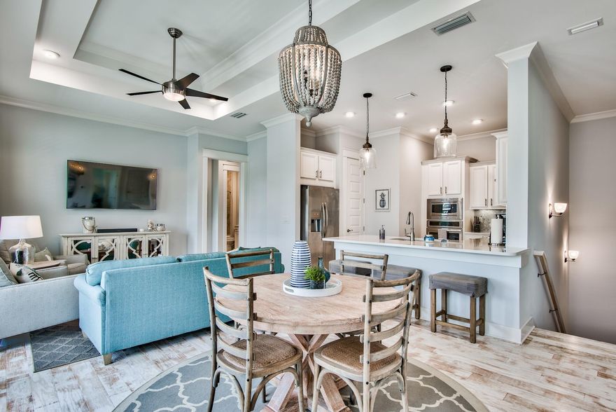 Investor alert!! Priced to sell, this well-appointed, sophisticated coastal home in the popular Prominence on 30A won't last long! This elegant beach home has never been rented and is ideally situated in one of the most quiet locations in the neighborhood backing up to the state park. With a spacious open concept floorplan and spacious one-car garage, this fully-furnished, turnkey ready home is perfect for families, couples or an ideal beach vacation investment property or second home.  Highlights of this charming home include: upgraded tile backsplash, quartz counters, gorgeous whitewashed hardwood floors throughout the home, 10 foot ceilings and expansive windows and French doors to bring in natural light. The spacious chef's kitchen with loads of counter space and full pantry has upgraded tile backsplash, quartz countertops, farmhouse sink and ElectroLux appliances. Master bedroom with ensuite has large walk-in closet, dual sinks, oversized shower and upgraded fixtures. The light filled second bedroom is well-appointed with set of French doors leading to the balcony and tub/shower combo with convenient hall access. Laundry room includes full-size washer/dryer. With resort-style amenities, convenient location across from eateries and shopping at the popular Hub and a short bike, shuttle or car ride to the beach, this coastal charmer offers the best of everything that's great about 30A.

This home has never been rented and makes for an ideal second home or vacation rental. Rentals for this maximized living space projected to be $40K+ in gross rentals. Don't miss this chance to call this elegant coastal home your next beach home.
