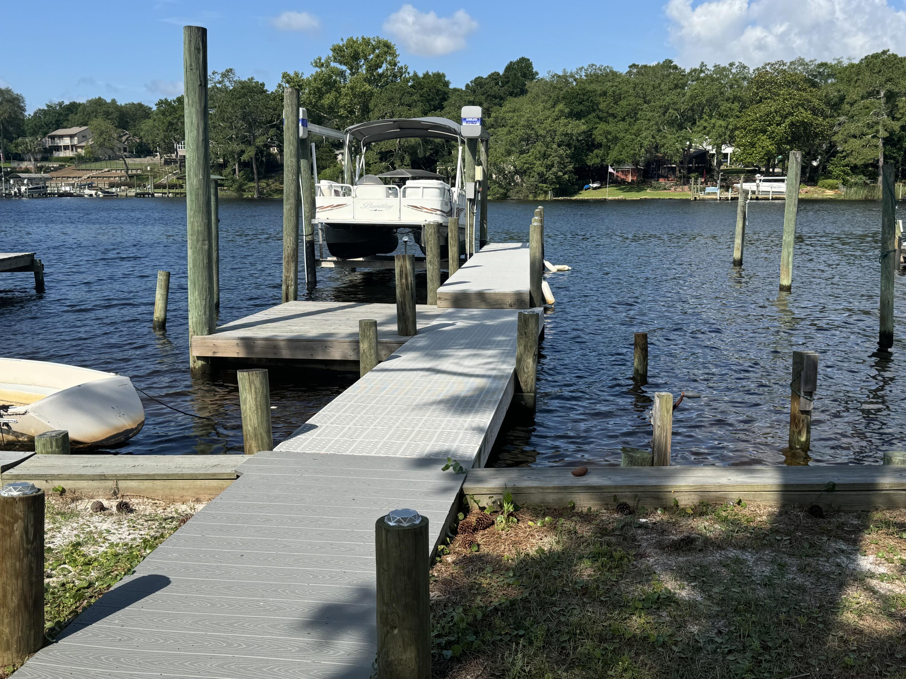 WATERFRONT townhouse with private dock directly on the Bayou!!!  This 2 story updated unit has granite countertops, stainless steel appliances and wood laminate and tile flooring throughout. Two bedrooms and two bathrooms, plus a large versatile flex room on the first floor which could be used as an office or 3rd bedroom.  Views from both floors make this the perfect spot to live the waterfront lifestyle.  2 Dedicated parking spots are included. No vaping or smoking allowed.