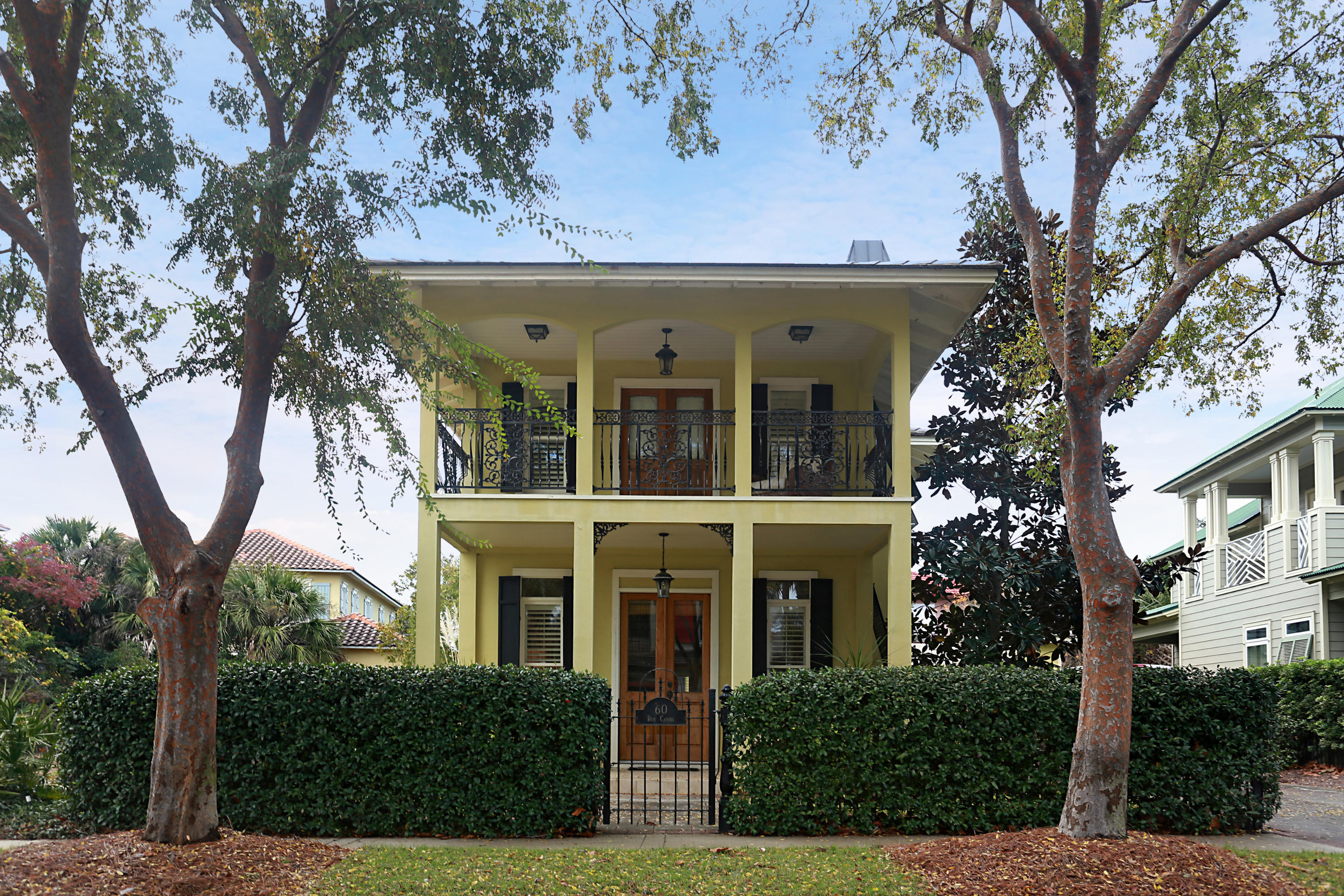 Flexible seller financing available on this picturesque New Orleans style double gallery home in the gated, Gulf-front community of Caribe. Cares melt away upon driving down Caribe's winding paver streets lined with rich verdure and colorful homes. This home's curb appeal makes a great first impression. A lush hedge fence with a wrought iron gate opens to a private courtyard, connecting the main house and carriage house. In addition to the covered galleries that distinguish this home, this pictorial getaway provides plenty of outdoor living space. Inside the main house adorned with hardwoods and painted wood plank ceilings, the updated kitchen features a Sub-Zero refrigerator, farm sink, granite counters, range hood, Wolf gas cooktop and breakfast bar. A fireplace in the open concept living room adds warmth to the room. The 2nd story master suite is a true respite with a private balcony that spans the width of the home. The loft area can be used as an office or sitting area. Guests will enjoy privacy from their 1 bedroom carriage house. There is plenty of storage space including a separate storage building. This home is just a short walk from the pool or the beach. Caribe is a gated, Gulf-front community located just west of the Sandestin Resort in South Walton County. Caribe's 100+ homeowners enjoy access to a private beach, two resort pools, and on-property tennis courts. This gated Gulf-front neighborhood is vacation rental capable. Vacation rental projections are available upon request.