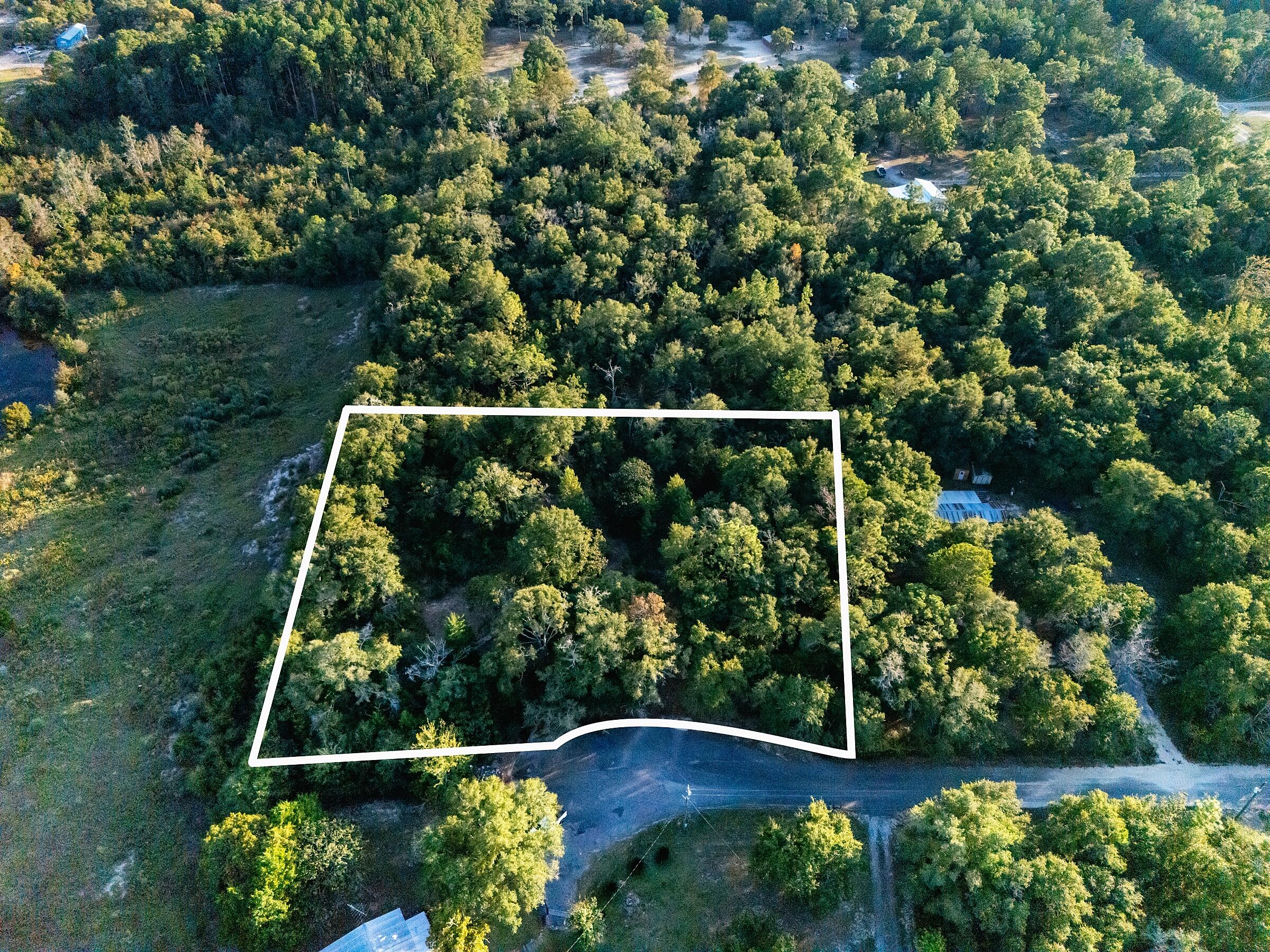 Build your dream home or investment property on this rare 1.3-acre double lot in DeFuniak Springs! High and dry in Flood Zone X with no wetlands. Located on a quiet cul-de-sac just 7 minutes from downtown. Fully fenced and can be split into two lots. Property has; existing well, septic, and power pole on site (as-is). A 12x28 shed was added in 2014. Perfect for mobile home, custom build, or rental investment. Enjoy peaceful country living with quick access to I-10, shopping, and schools.