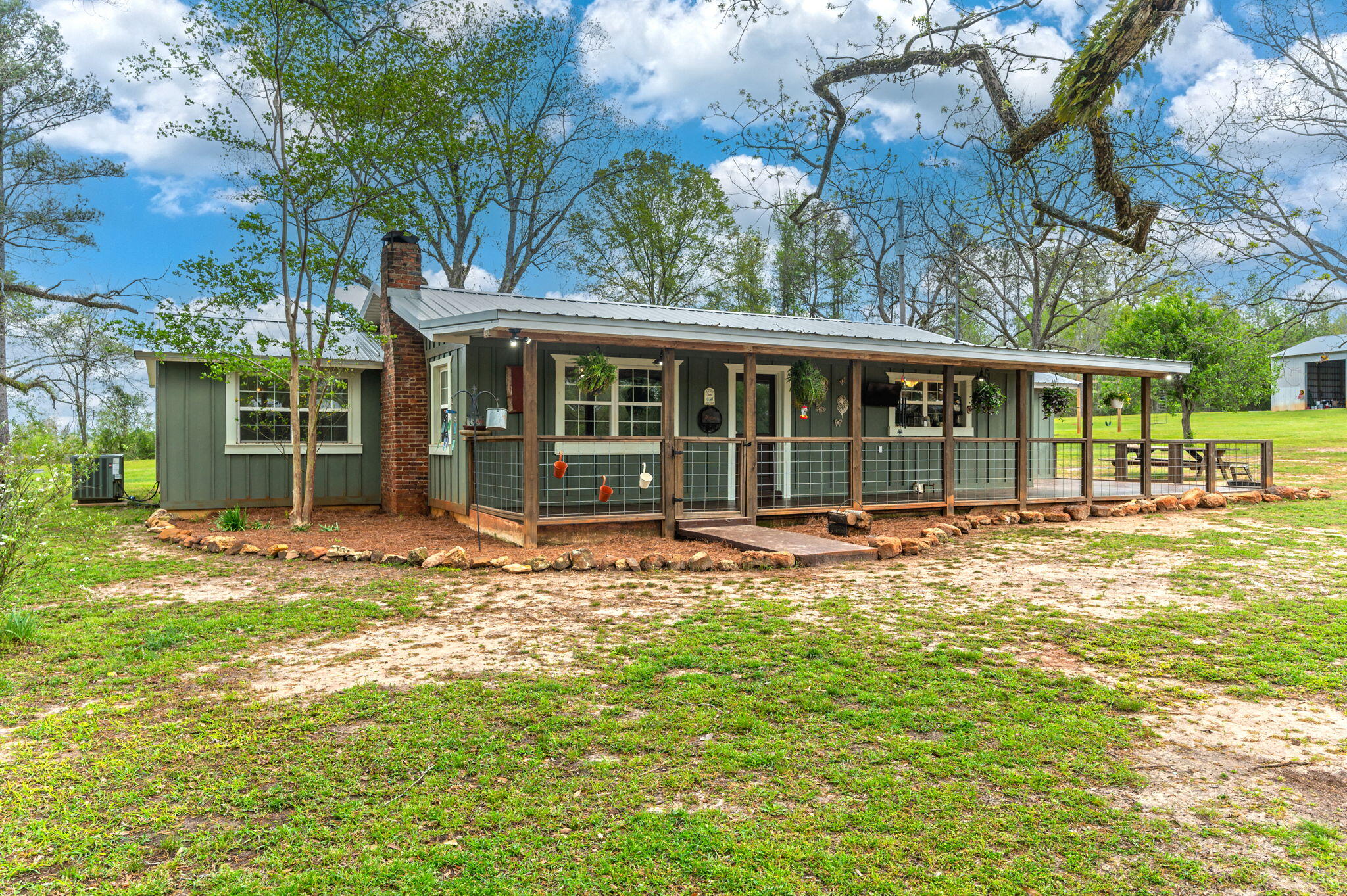 Discover country living at its finest with this charming 3-bd, 2-br home. Embrace the tranquility where mail carriers are your only passingtraffic! The spacious property features a welcoming front porch perfect for sipping morning coffee while enjoying the rural serenity.Animal enthusiasts will appreciate the well-equipped chicken houses complete with water, power, and concrete slabs. For the handymanor hobbyist, the large metal workshop boasts two roll-up doors, an office space, and a bathroom--ideal for projects or potential businessventures. Inside, discover a flexible floor plan including a generous bonus room accessible through the front bedroom, offeringpossibilities for a home office, nursery, or hobby space. Just 5 miles from beautiful Gantt Lake, this property delivers authentic countrylifestyle without sacrificing convenience. A rare opportunity where practicality meets rural charm at an attractive price point!