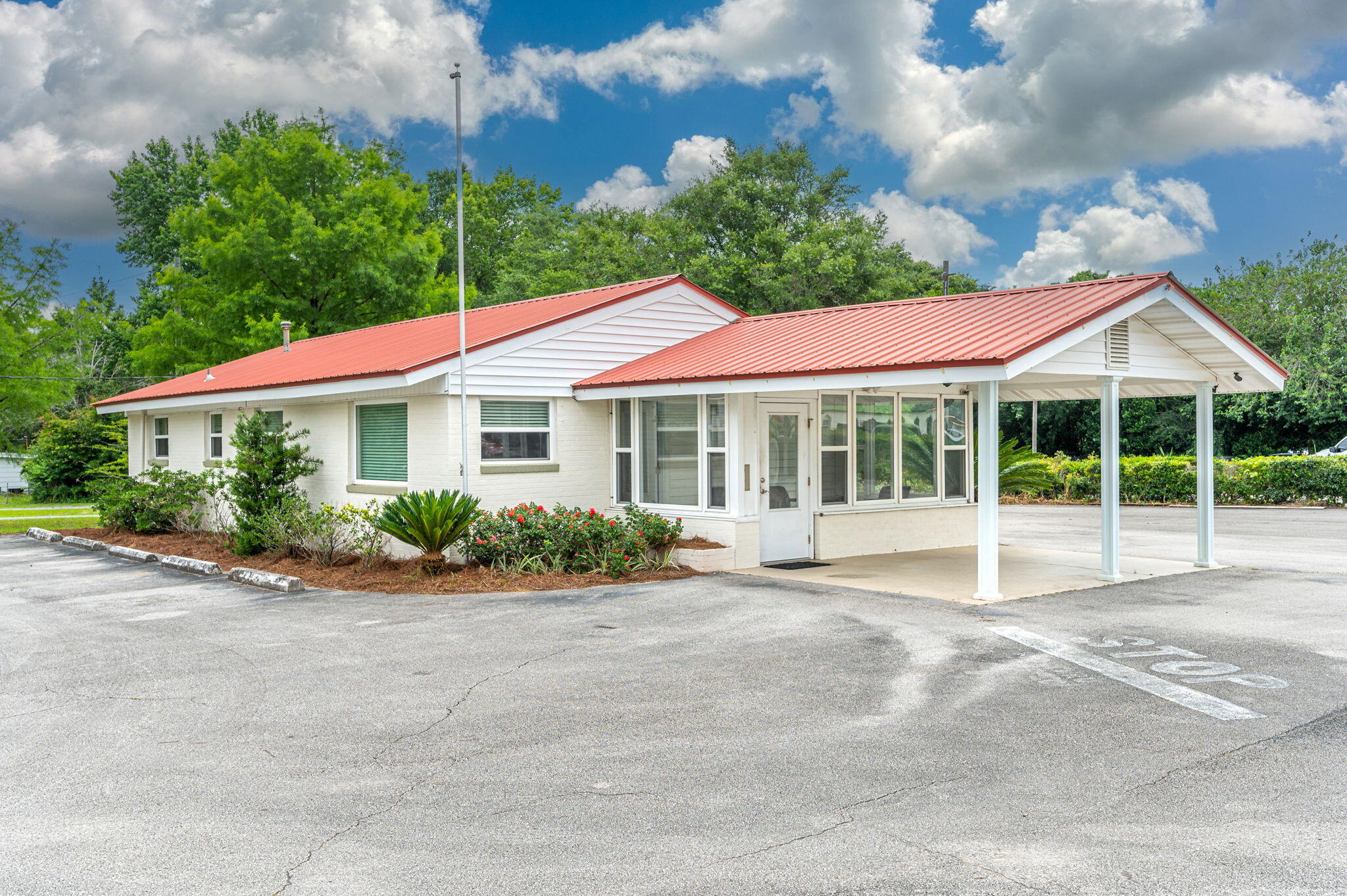 Commercial opportunities like this are a rare find in DeFuniak Springs. This property includes over an acre with 150 feet of highway frontage on Highway 90. The office building has a front porch area, a large reception area, two offices, two bathrooms and a storage area. This property is zoned Light Industrial which allows for any uses allowed in C-1 & C-2 that does not require review along with wholesale, warehouse and storage use. See Documents for more information. The lease will be a three year term with a set amount of $3500 per month which includes lawn service. Tenant will be responsible for all utilities. Parking lot has a minimum of 20 spaces and this lease does include the back lot! Lawn & Facility Maintenance included in lease amount!
