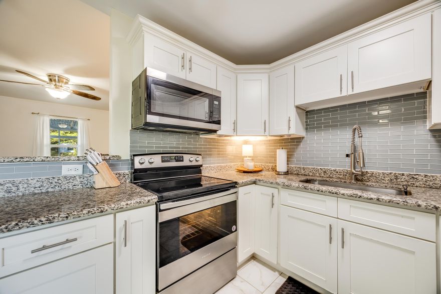 MOTIVATED SELLER offering $5,000 toward your closing costs! This beautifully renovated 3-bedroom, 2-bathroom home sits on an oversized lot in Crestview, surrounded by mature oak trees that provide plenty of shade and charm. Step inside to discover a fresh, modern interior featuring LVP flooring throughout, granite countertops, white shaker-style cabinets, and sleek stainless steel appliances. The home also includes a tankless hot water heater for energy efficiency. Enjoy morning coffee or evening relaxation on the freshly renovated screened-in front porch. The backyard is fully fenced with a brand-new privacy fence--perfect for pets, play, or entertaining. This home is turn-key, packed with upgrades, and priced to move--don't miss your chance to grab a great deal in a desirable location!