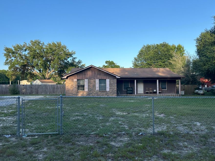 GREAT INVESTMENT OPPORTUNITY. Solid brick home on a nice-sized lot with loads of potential. Garage has been enclosed for extra living space. Functional layout ready for your updates.