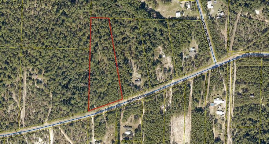 5.27  wooded land to build your dream home. Just a short drive to the beautiful white sandy beaches of South Walton and Panama City.  Lot measurements are subject to an up-to-date survey.