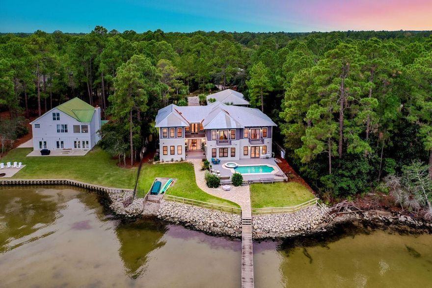 Exemplary bay front location presiding over 100' of prime water frontage juxtaposed ample privacy & serenity while offering close proximity to 30A and 331 in the heart of Santa Rosa Beach. This pristine family compound is finely appointed and ideally comprised of 6,300 sqft in the main house and over 1,500 sqft in the guest quarters primely situated on half an acre with notable features including a three car garage, spacious in ground pool & sun deck and private dock with boat launch. This incredible estate yields an unparalleled lifestyle with a sprawling structure that takes full advantage of the waterfront location. The main house offers an open floorplan with a spectacular entry foyer highlighted by direct bay views and a double height ceiling.