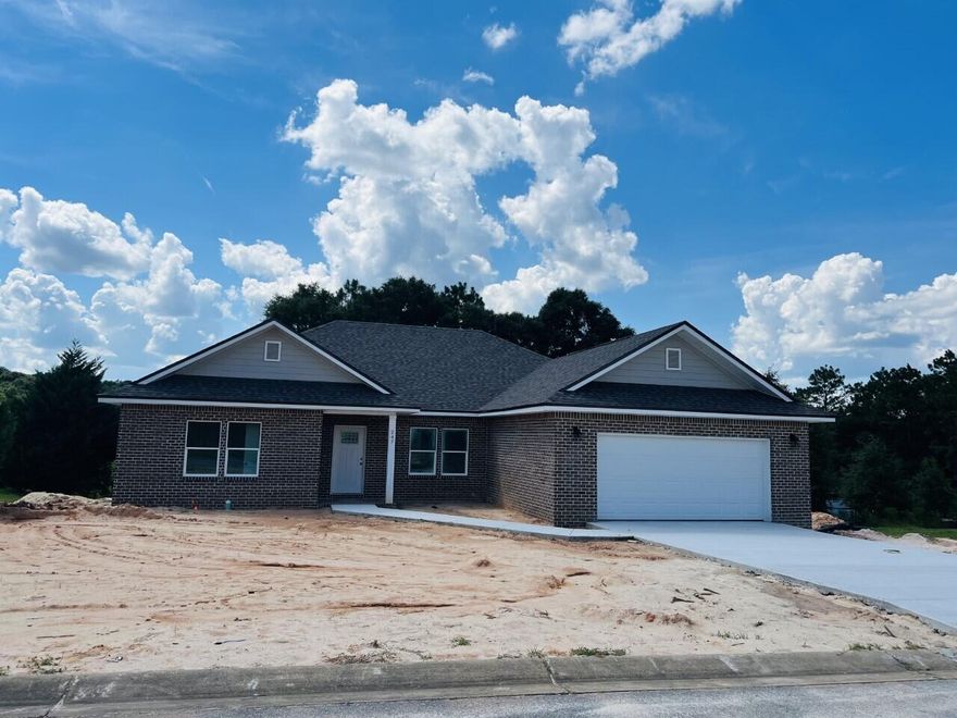 BEAUTIFUL CUSTOM 4 BEDROOM 2 BATH BRICK HOME WITH 9and 10 ft CEILINGS.  The roof has been upgraded with spray foam insulation for more energy efficiency.   YOU WILL LOVE THE VERY OPEN FLOOR PLAN!! THE KITCHEN BOAST CUSTOM ALL WOOD CABINETS WITH SOFT CLOSE DRAWERS, STAINLESS APPLIANCES, PANTRY, STAINLESS FARM SINK, GRANITE COUNTER TOPS ALONG WITH WOOD LOOKING VINYL PLANK THROUGHOUT THE HOME.  A FLOOR PLUG IS INSTALLED IN THE FAMILY ROOM AS ANOTHER UPGRADE WITH REVERSE TREY CEILING WITH LIGHTING.   MASTER BATH IS HEAVENLY WITH IT'S RECESSED LIGHTING, GRANITE COUNTER TOPS, CUSTOM TILE SHOWER WITH BENCH, RAINHEAD, SEPARATE SPRAYER AND A 6FT TUB for relaxing!.  This home is perfect for entertaining with its open floor plan.  You will enjoy the easy up-keep of the yard with