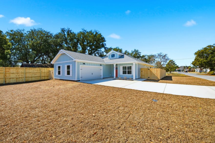 NO HOA, corner lot, fully fenced AND 3 minutes to Navarre Beach! This semi-custom newly completed build offers 1965 square feet of spacious living with 4 bedrooms, 2.5 bathrooms, right in the heart of Navarre, with glimpses of the sound from your front yard!  This home's standout features include custom cypress wood beams and vaulted ceilings, adding warmth and character to the already beautiful and open design. The walk in pantry, gas range, and side-entry garage make for a modern and comfortable living experience that you'll enjoy every day. Don't forget your gas fireplace to cozy up to on those chilly overcast days! The master bathroom boasts a luxurious free-standing tub and beautifully tiled shower, offering a spa-like experience at home. You'll never have to worry about running out of hot water with the tankless water heate a feature that will surely impress. This is not your average builder-grade house - it's a true gem with curated designer fixtures and finishes. With a focus on personalized service and attention to detail, you can trust that your home-buying experience will be second to none. Contact us today to learn more about how you can make this house your forever home! Some selections still available for buyers to customize fixtures and finishes! Estimated completion Jan 2026