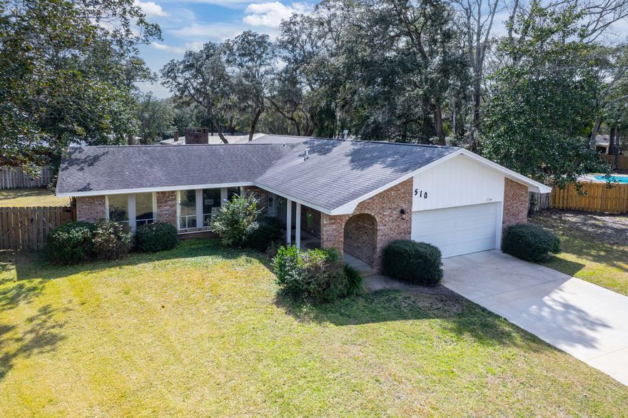 Back on the Market, no fault of the seller - Bring an offer! *New Stainless Steel fridge installed 8/12/25* Welcome to 510 Sioux Circle, a lovely home in Fort Walton Beach, FL, located in the family-friendly neighborhood of Overbrook. Centrally located to both Hurlburt Field and Eglin AFB, this is an ideal location for Active Duty and DOD personnel. Fort Walton Beach is rich in activities and scenery such as public parks and recreation, emerald water beaches on Okaloosa Island and nightlife downtown. With many shopping and dining options nearby, there's something for everyone. This home features a spacious living area with new LVP flooring installed in 2023 and a cozy brick surround wood-burning fireplace.  The back sliding glass door is hurricane-rated for added safety. The open concept design allows for plenty of natural light, complemented by the many recent renovations throughout. The kitchen is a highlight with bright quartz countertops, a mix of stainless steel and white appliances, a modern tile backsplash, and a kitchen island with storage. The primary bedroom offers double closets, while the bathroom includes a double vanity and a large tile walk-in shower with an oversized rain showerhead and a handheld showerhead. Additional features of this home include a new HVAC system installed in 2024, a hot water heater installed in 2022, PEX plumbing, and hurricane shutters. A whole-home Generac generator, serviced yearly with a battery replaced in 2023, ensures peace of mind. The walls and ceilings have been freshly painted, and the driveway was repaved in 2022. 
