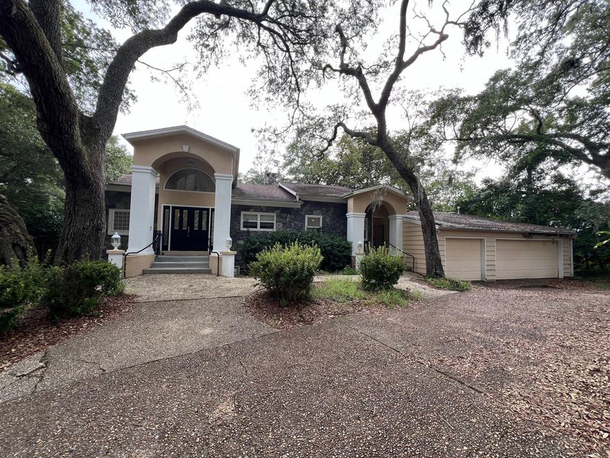 Gorgeous Waterfront Location, Close to Beaches, Bases, Schools & Shopping! 106 feet on protected deep water of Chula Vista Bayou, this Waterfront 4 Bedroom, 3.5 Bath home is located at the end of a cul-de-sac and has a 3-Car Garage!  There is laminate and tile flooring throughout most of the home. The 2nd (main) floor has multiple wall-to-wall over-size sliding glass doors overlooking the bayou.  There is a Large Primary Living Room with a Serene Waterfront view and features high ceilings, plenty of natural light and a two-sided wood burning fireplace that also adjoins the Dining Room.  The Gourmet Kitchen has Wood Cabinets, Granite Counter Tops, a second Sink, 2 Pantries, Breakfast Bar, Cooktop, GE Profile Oven, Microwave and opens to the Breakfast Room.  The Laundry Room has a utility