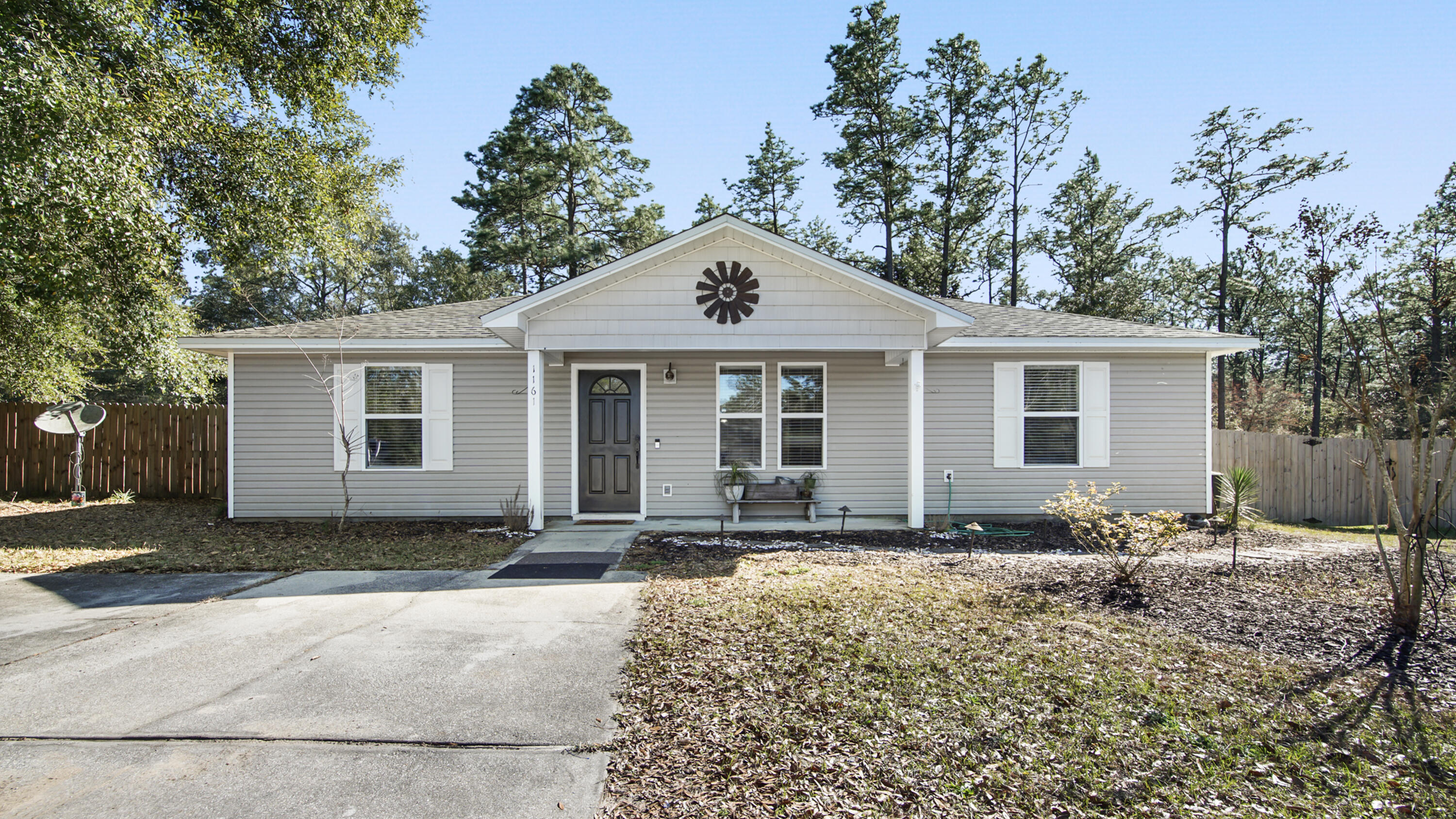 Discover the charm of southern living in this home just outside city limits of DeFuniak Springs. With 1,242 sqft of comfortable living space, property is a perfect blend of functionality and style. Kitchen appliances less than 3 years old, washer/dryer remains and no carpet for easy maintenance. Great backyard with firepit & privacy fence, offering a serene retreat for relaxation and family gatherings. Small workshop in backyard with double gates for easy access. Just a short drive away from local amenities and for those who cherish the outdoors, Ideal for anyone looking for manageable lot size & favorable price point, this cozy home is a peaceful sanctuary to create lasting memories. Seller will replace roof with acceptable offer.