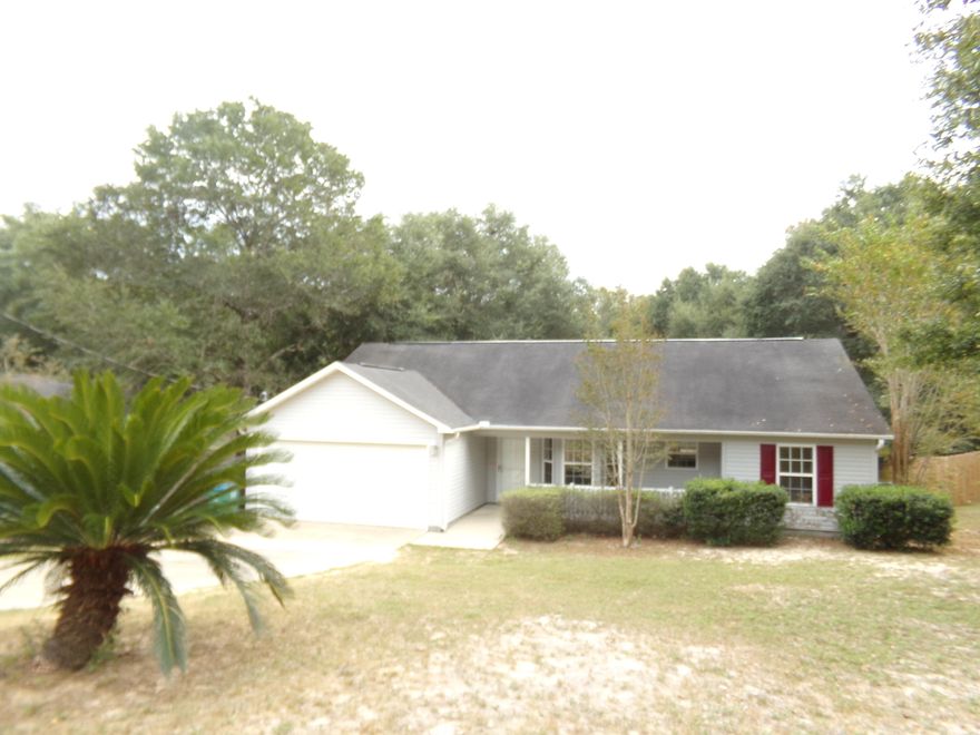 Very nice home with tile floors in the entryway and Kitchen and laminate wood throughout the rest of the home. Kitchen has granite counter tops, and a large breakfast bar. Stainless steel refrigerator and smooth top stove are included. Home has a large family room with cathedral ceilings and is a split floor plan. Back yard is large and fenced. 12 x 22 spacious deck on the back. Must have first month's rent and security deposit equal to the first month. No pets allowed.