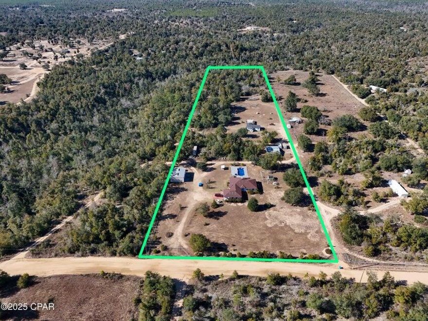 Dream Farm Homestead on 10 Acres - Just 30 Minutes from Panama City!Welcome to 20413 Deep Springs Road, a stunning 10-acre farm property nestled in the quiet countryside of Fountain, FL--offering the perfect blend of rural living with convenient access to the city. Located just 30 miles from Downtown Panama City, 45 miles from the sugar-white beaches of Panama City Beach, and 30 miles from the airport, this one-of-a-kind property is the ultimate retreat for those seeking space, functionality, and endless potential.The property is fully fenced and cross-fenced, ideal for livestock, horses, or any other outdoor pursuits. The main home is a solid block-constructed residence featuring 4 bedrooms, 2.5 bathrooms, a split bedroom floor plan, and an expansive 4-car attached garage (25x36). With an inground pool and spa, wood-burning fireplace, sunroom, and 12 skylights, this home offers both comfort and character. The layout is perfect for families or entertaining, with an oversized kitchen, breakfast nook, formal dining room, and spacious living areasall offering an abundance of natural light and storage.

Step outside and enjoy your private pool oasis, complete with oversized patio space and tranquil water featureperfect for entertaining or relaxing in total privacy.

But that's not all:

A massive 32x42 detached workshop with oversized roll-up doors provides ample space for boats, vehicles, tools, or even a home business.

A separate barn offers great utility for animals or equipment.

A second residence, a 3-bedroom, 2-bath manufactured home (1987), currently used as a rental, is perfect for guests, a caretaker, or multi-generational living.

No HOA and flexible county zoning means your options are wide openwhether you dream of a working farm, income-producing rental, or simply space to spread out and enjoy country life.

Opportunities like this don't come around often. Schedule your private showing today and discover all the possibilities this remarkable property has to offer!
All sizes approximate and taken from public records - please verify any details buyer deems important.
