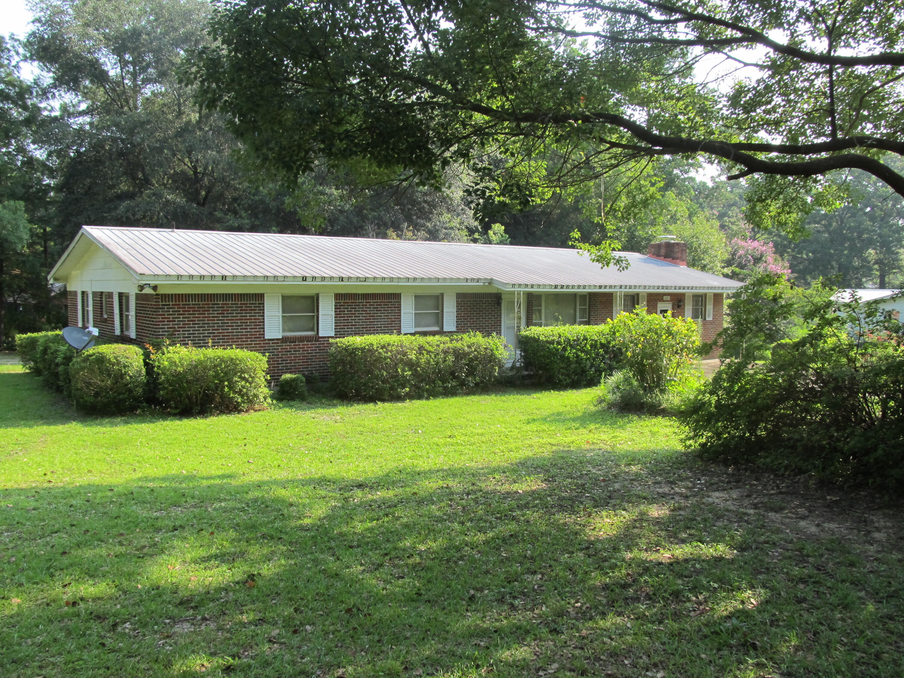 Properties like this don't come along often. This 4 bedroom 2 bath home on 2.3 acres features beautiful azaleas, fruit trees, pecan trees, magnolia trees, grapevines and the perfect spot to garden. All your equipment can easily be stored in 40X60 barn w/ 20X60 loft. Home was originally built by the family in 1964 with the garage enclosed in later years for a cozy family room with fireplace. Home also offers additional space for an office and has a large attached laundry room. Property is a desirable corner parcel with county maintained road to access the backyard and provide additional privacy. Don't let age of home keep you from viewing, this well maintained home has so much potential. Conveniently located to beaches, Eglin AF Base, and shopping.