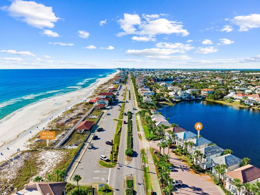 Exquisite Gulf-view retreat ideally situated directly across from the beach, offering breathtaking water views from every room. This unique property features two beautifully appointed units, each a spacious one-bedroom, two-bath residence designed for comfort and flexibility. Enjoy seamless indoor-outdoor living with private decks--one overlooking a tranquil lake and the other capturing unobstructed Gulf vistas. Each home includes a full kitchen, washer and dryer, dining area, generous family room, and two full bathrooms. The versatile layout allows you to rent the units separately, combine them for larger gatherings, or reserve one as your own private coastal escape. Recent upgrades listed in documents include cabinets, flooring, baths, paint.