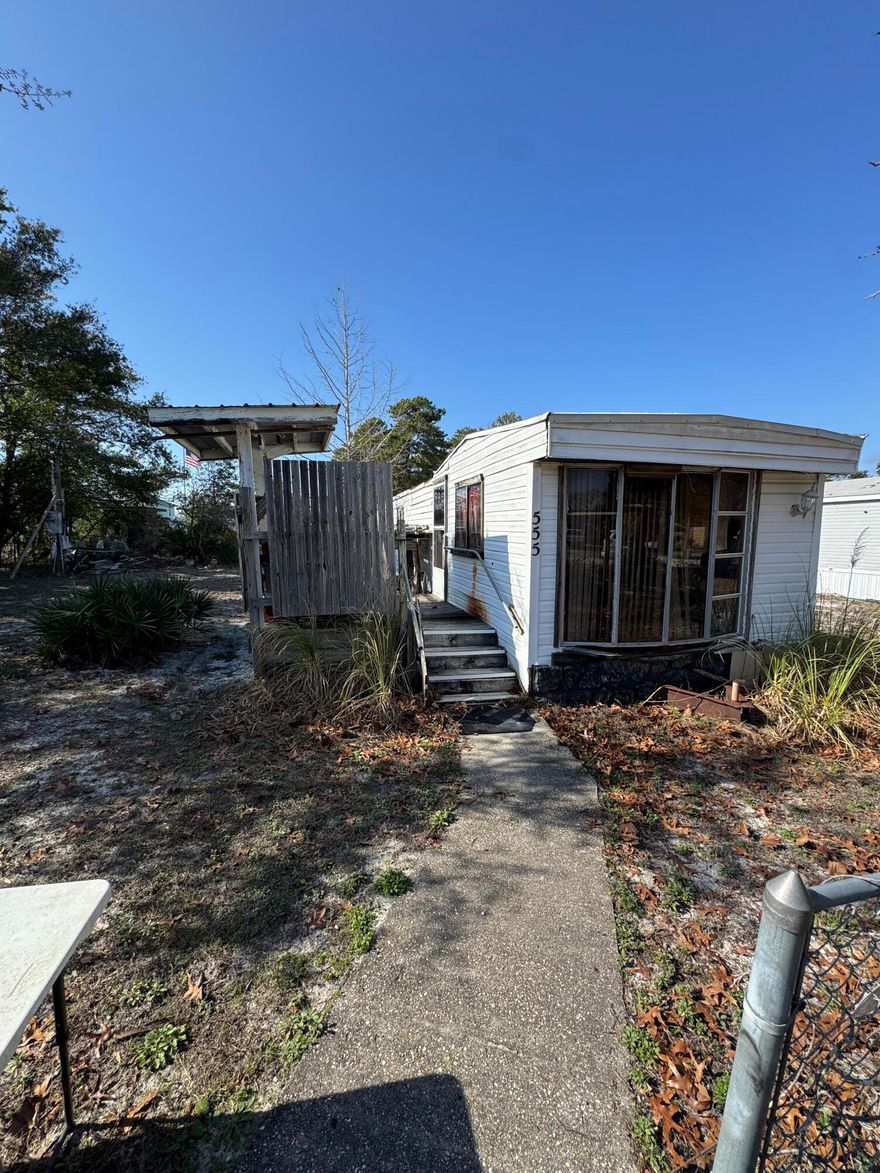 CURRENTLY UNDER CONTRACT, SELLER WILL CONSIDER BACKUP OFFERS Prime West End Location - Build Your Beach Dream! Great property for investors. Discover the perfect opportunity to build your dream beach home or investment property in the highly sought-after West End of Panama City Beach! This expansive lot--just over a quarter acre--offers plenty of space for a pool, duplex or a spacious single-family retreat. Located just blocks from the sugar-white sand and emerald waters, this golf cart-friendly community of Laguna Beach boasts a laid-back, coastal vibe. Enjoy easy access to local favorites like Thomas Donuts, Carousel Grocery, Pier Park, and 30A. With zoning for short-term rentals, this property is ideal for a primary residence, second home, or lucrative investment opportunity.

Ample parking is available for boats and RVs, making it a true beachgoer's paradise. Trailer on-site is uninhabitable and unavailable for interior access.

Don't miss this incredible chance to own a piece of paradise on the West End! Call today for more details. 