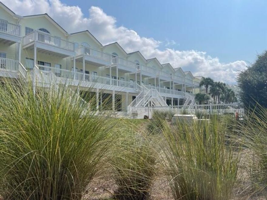 Priced to Sell! 2 BR 2.5 BA Townhouse with covered parking and ground floor utility/beach gear room. New paint and flooring inside. 2nd and 3rd level balconies overlook pool area. Large kitchen pantry & separate laundry with additional storage. Heat pump recently rebuilt and serviced, coils in handling unit professionally cleaned.  New Water Heater 2022. Complex features pool and tennis courts. S Spooky Ln Beach/access less than 300 yards to 1,000' of County owned Public Beach.  No short-term rental history but much potential. Easy to view.
