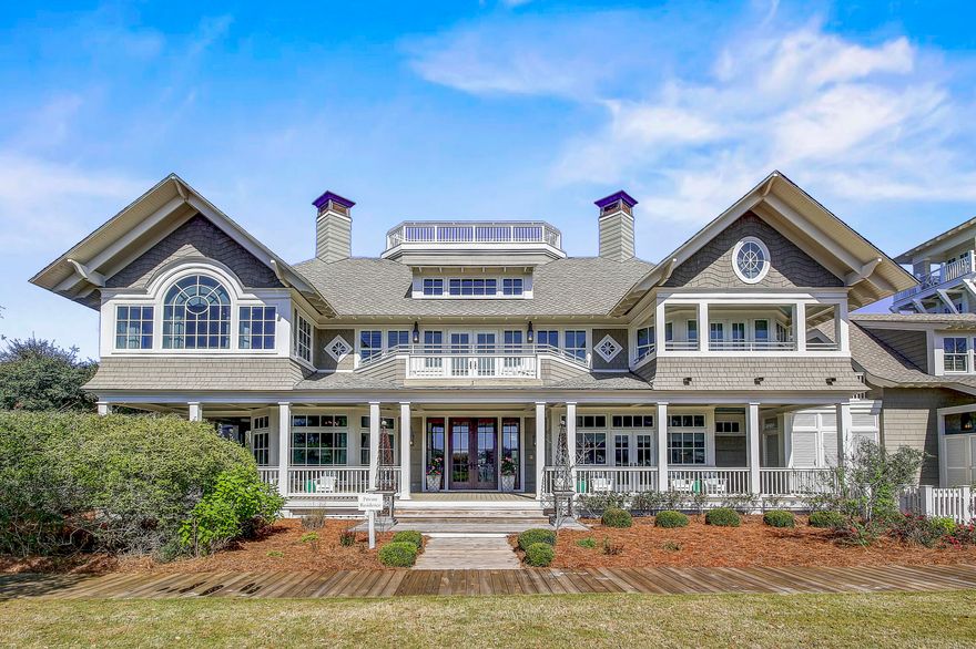 Stately positioned in the gated WaterSound Beach community amid luscious landscape, rolling dunes, and the Gulf of Mexico, this Legacy Home has been featured as the 'Dream Home' in Southern Accents Magazine.   As the original and first home built in WaterSound Beach, it set the tone and the benchmark for the up-and-coming community's aesthetics, inspirational style, and charm. John Kirk of Cooper, Robertson and Partners, New York, designed the home with large Palladian and Bay Windows, Shingle style, deep wrap-around porches, breezeways, and Widow's Walk showcasing the panoramic view of the Gulf of Mexico.