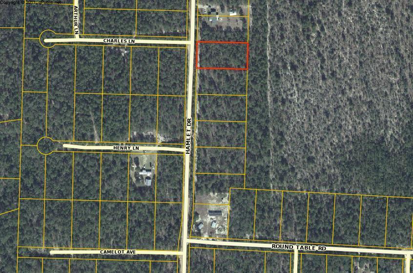 Growing Area! One acre wooded lot. Some utilities in the area. This will not last long. Buy now and build later.