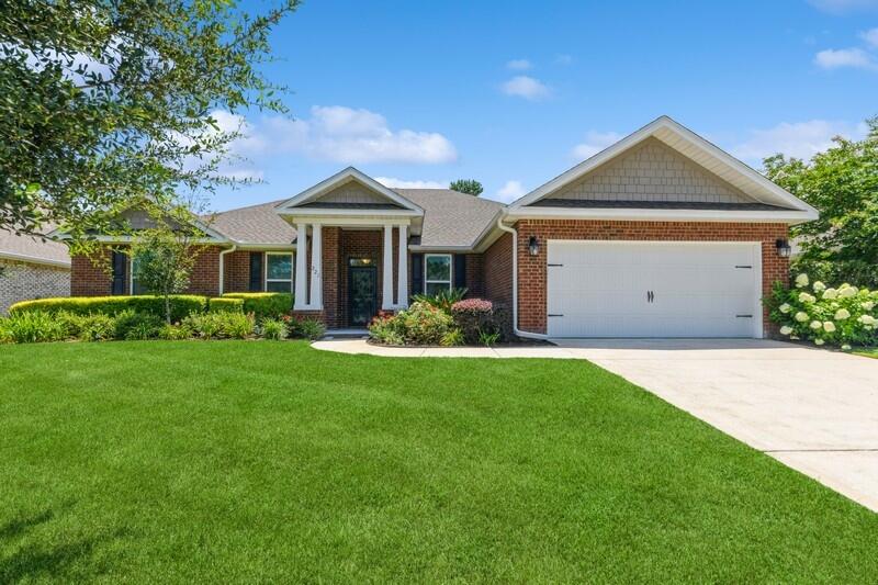 This stately all brick, 4 bedroom, 3 bath home features a designated office AND a separate dining room with a split bedroom and open concept floor plan! A welcoming, updated interior is sure to impress with wainscoting in the dining and breakfast room, crown molding in all living areas, and 10' -12' ceilings, custom pull out shelves in kitchen cabinets with an extended island and custom storage underneath; residents also benefit from central gas for heat, ac, water heater, oven, and range in the event the grid is out! The oversized primary suite with owners retreat overlooks the backyard with mature landscaping and privacy fence. You will love to entertain friends and family in the covered screened in back porch or follow the paver walkway to the16 x 16 custom built gazebo featuring recessed lighting and a ceiling fan, along with numerous electrical outlets for your maximum comfort. Hammock Bay is a premier, bayfront master planned community located just 15 minutes north of the white sand beaches of the Emerald Coast. A 6,000 square foot clubhouse offers residents use of the movie theatre with auditorium seating, a full caterer's kitchen to include wet bar and dining area, childs play room, and lounge overlooking the lake and pool area. Numerous on site workout and fitness facilities, competition lap pool, additional 4 Resort-style pools, pickleball courts, tennis courts, basketball court, large playground, outdoor kitchen/gas bbq areas. A Bay front club house with fishing pier extending 500' in to the bay, an amphitheater like stage with jumbotron screen, are just a few attractions with more on the near horizon! All residents at Hammock Bay will enjoy year-round social events as well as a vibrant and active Town Center. Consider this an invitation to experience the Hammock Bay Lifestyle by contacting me today for an updated list of this months community events calendar!