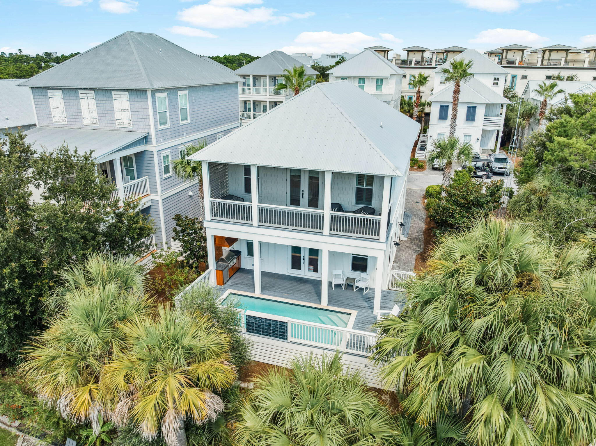 No Saturday Showings, Please. Welcome to 23 Dune Side Lane, a coastal retreat designed for both relaxation and memorable gatherings. Nestled in the heart of Blue Mountain Beach, this spacious two-story home offers the ideal blend of privacy, comfort, and convenience just a short stroll or golf cart ride from the white sand and turquoise waters of 30A.Inside you'll find an open, light-filled layout with four large bedrooms, including two master suites (one on the first floor), plus a dedicated bunk room that's perfect for kids or extra guests. The balconies invite you to slow down and savor Gulf breezes, while the backyard oasis is designed for fun and relaxation with a sparkling pool, soothing waterfall feature, and heating option for year-round enjoyment. Surrounded by mature magnolia, pine, and fruit-bearing trees, this property offers a peaceful natural backdrop that's rare along 30A. Whether you're seeking a full-time residence, vacation escape, or a strong rental investment, this home delivers on every level.
Duneside at Blue Mountain Beach is a welcoming community complete with a park, making it easy to enjoy outdoor gatherings just a moment from your door. With its unbeatable location, and thoughtful design, 23 Dune Side Lane is ready to become your family's next chapter along the Gulf.