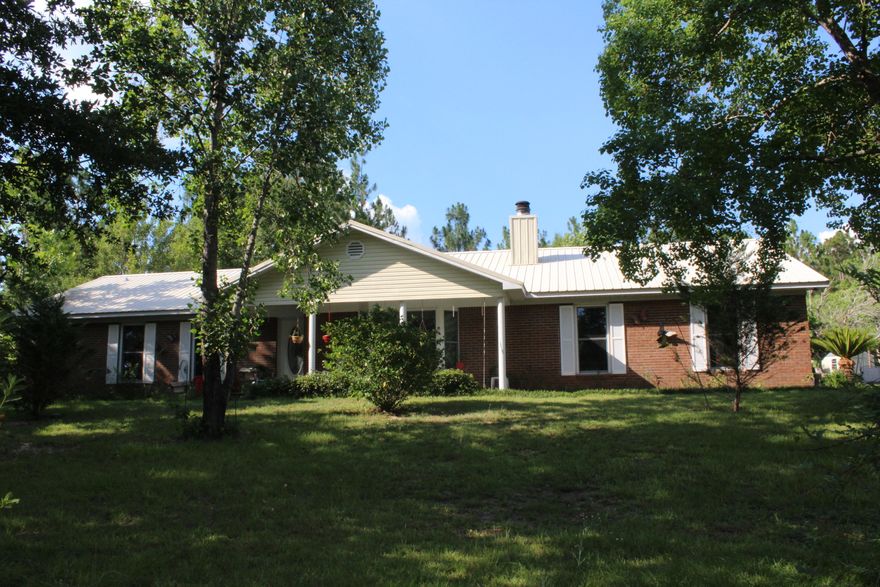 Short Sale: Over 12-17 Acres and a pond!! This home features 3 bedroom/3 baths and 1861 sq ft! Enter the foyer into an open floor plan. The living room opens to the kitchen. The living room features a bay window and a wood burning fireplace. The kitchen has breakfast bar that seats 3-4. Just off the kitchen is an extra large laundry room, Florida room and full bathroom! The master bedroom is large and features a nice master bathroom. There are an additional two bedrooms that over look the backyard. This home allows for much privacy! If you are looking for privacy and land, but still close to Crestview, shopping, dining, and schools, make an appointment to see this property! Buyer to verify all dimensions and information. Appliances do not convey.