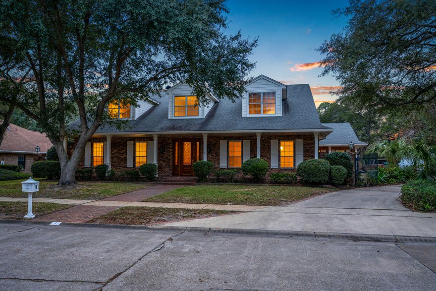 A brick walk way & an expansive front porch welcomes you home to 1 Sleepy Hollow Rd. This spacious home boasts over 5,000 sq. ft. with 4 bedrooms & 4.5 baths & a boat slip! A grand staircase greets you upon entering the home & leads you to a great room with soaring ceilings, entertainment bar, built in book cases, gas fireplace & french doors to the sun room. The gourmet kitchen features gas cook top, granite counter tops & stainless appliances. The impressive master suite offers a private sitting area, wet bar/coffee bar, his & her closets with plenty of shelving. The master bath has large walk in shower, separate soaking tub & huge vanity with plenty of cabinet space. The second story wows you with a large loft overlooking the great room, built in bookcases & pool table!