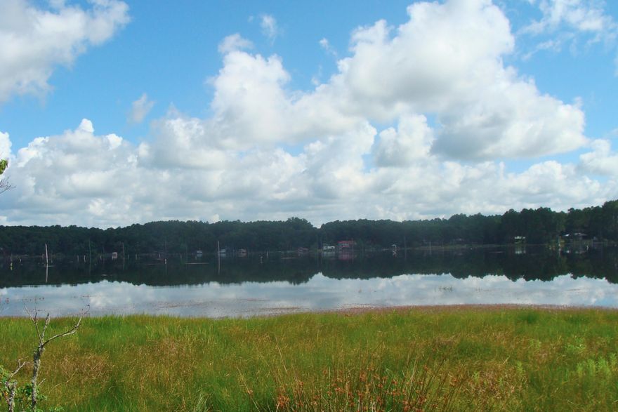 WATERFRONT GETAWAY -- Juniper Lake fish camp!
Mobile home on a half-acre waterfront lot with 90' on one of the best fishing lakes in Walton County. Fish from the dock or take your boat out on this 630 acre lake full of brim, crappie, bass and catfish. Juniper is the only State maintained lake in the area, which means no HOA fees and the State takes care of all maintenance on the dam. Little value has been given to the mobile home which is older and has been sitting for a while, but it has much potential as livable space. There is City water (tap fee paid), a power pole & meter. a septic tank, and an older dock on this property. Seller had a path bushhogged to the water so you can see the potential of this diamond in the rough. We predict this property won't last long!