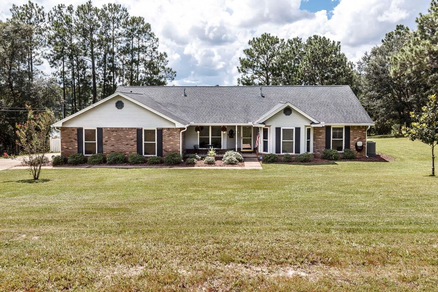 Crestview waterfront living at it's best: 226 feet of water frontage! Drop your kayak from your very own backyard, and fish the lake for bass, perch, or catfish. The peacefulness of this property is evident, while still being conveniently located to Crestview High School and the new Publix shopping center. The charming 3 bedroom home on 1.03 acres has been meticulously maintained and includes so many extras that ''typical'' homes do not: whole home Generac generator, dual temp wine fridge, 2 sided gas burning fireplace (cozy living area AND kitchen spaces!), massive Florida room with floor to ceiling windows offering a picturesque view. Kitchen features granite countertops, stainless appliances, island with additional storage/seating, and access to a massive laundry room. A must see!