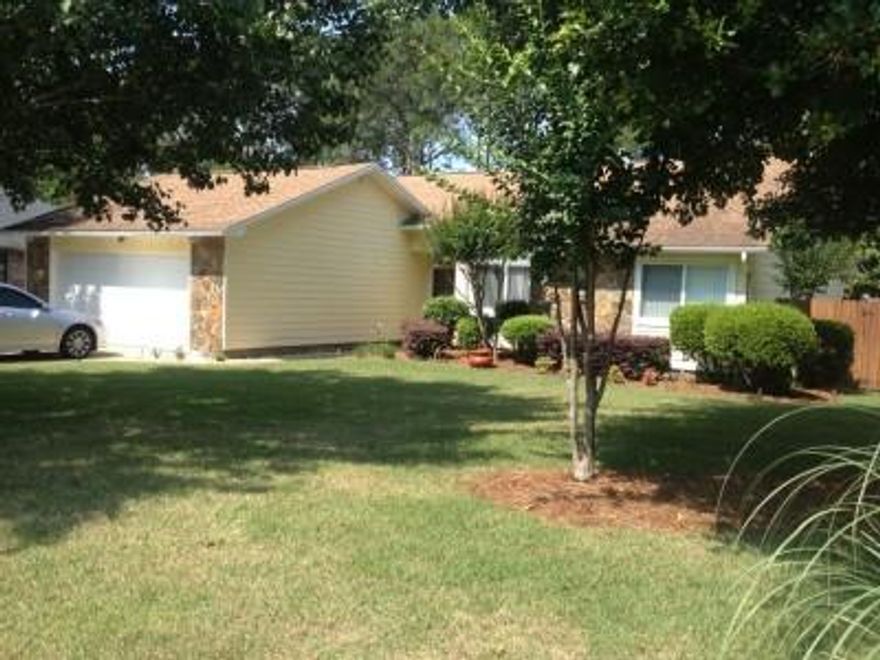 Charming Bluewater Bay St. Andrews Village family home has been well maintained with many upgrades. It has 1633 sq ft, 3 bedrooms, 2 baths and 2 car garage. This home features an excellent floor plan with large eat-in-kitchen, dining room separated from the great room by a stone peninsula fireplace, nicely sized bedrooms, one with wood floors and flat-screen TV and the other with a cedar closet, oversized garage w/pull down stairs for additional storage, and a fabulous fenced backyard with a huge deck preserved with Deck Over and a great hot tub for relaxing. The exterior was with Hardy Plank in 2011. The beautiful landscaped yard was installed in 2012, chimney exterior and crown replaced and Refrigerator replaced in 2012. New lawn pump installed in 2014.