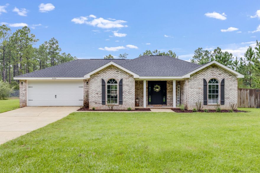 All-brick home on .75 acres featuring 3 bedrooms, 2 bathrooms, and a flex room that can serve as a 4th bedroom or office. The home has been freshly painted throughout and offers new flooring in every room. The kitchen is designed with granite countertops, tile backsplash, and stainless steel appliances. The master suite includes a trey ceiling, walk-in closet, double vanity sinks, and private access to the back patio. The outdoor living space features a large covered patio with wood plank ceiling and ceiling fans, leading to an in-ground pool with a new liner. Roof replaced in 2024. The spacious .75 acre lot provides room for outdoor activities, entertaining, and future possibilities. Buyer to verify all measurements and information deemed important.