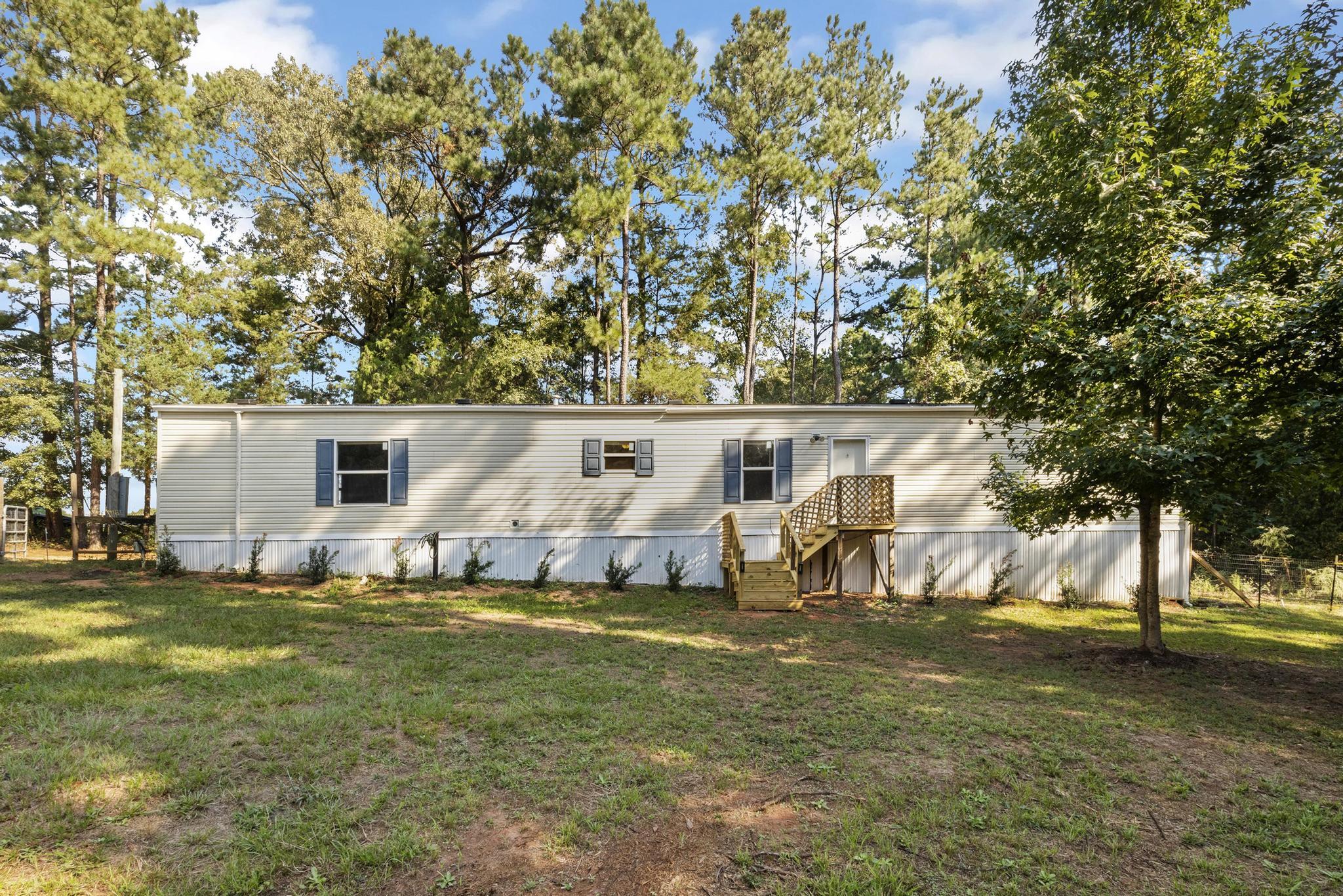 This newly updated 3 bed, 2 bath home that sits on 4.61 acres is a rare find.  With over 1200 square feet of living space, its ready for a new owner to add their personal touch. The front covered deck is brand new, spend mornings or evenings relaxing and taking in the country air. All the flooring has been redone, along with some of the windows, back deck, fenced yard, new paint, & pressure washed.  Don't miss out, this country charmer definitely won't last long!