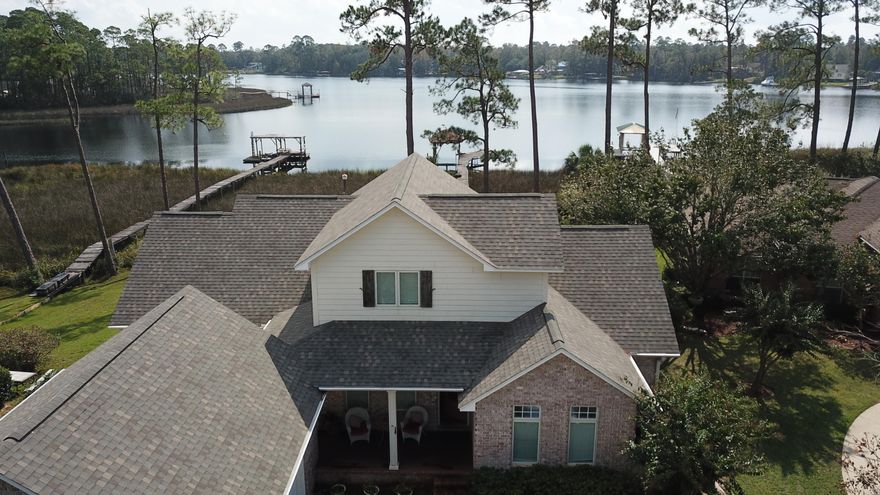 Beautiful custom waterfront home close to 1-10! Bernath Place is a lovely, quaint community on Mulatto Bayou offering residents privacy plus convenience. Step into the home and find an open floor plan with high ceilings, wood floors, crown moulding and windows galore offering a fabulous view of the bayou. Gaze at the water as you cook in your large kitchen or relax in your living room. Everyone can have their privacy with the split floor plan and 3 en suite bedrooms. A large bonus room upstairs provides the perfect space for an office, playroom or additional sleeping. First floor master offers beautiful bayou views and a master bath with dual vanities, a jetted tub and separate shower. And wait until you see the huge master closet! Watch dolphins from your screened in porch and back porch.