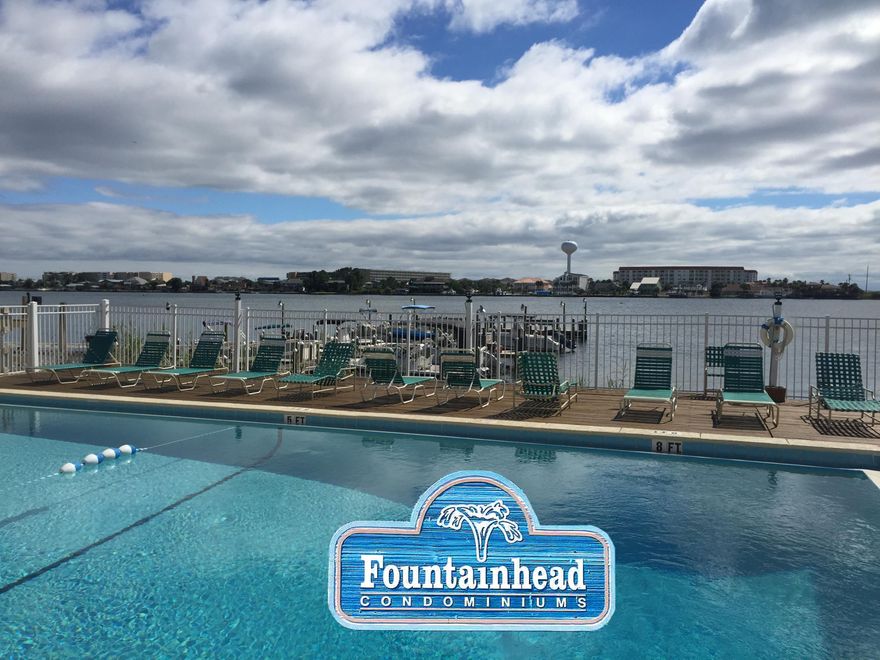 180 degrees Waterviews. Beautiful One Bedroom condo on the second floor with stunning views of the Intracoastal Waterway and even some Gulf views in the distance. Beautifully done inside with new granite counters in the kitchen and glass tile backslpash, jetted tub and convenient to our beaches, shopping and dining. Literally closer than a stones throw to the water, this is Florida living at an amazing price. The complex includes tennis court, pool on the water side, boat dock with slips available for rent on an available basis, community room with pool table and kitchen, and a beautiful court yard.Come see this amazingly priced condo on the water. Existing washer and dryer does not convey but will be replaced with another set.