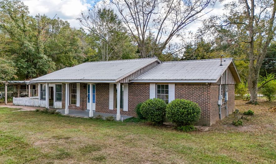 Located on over 0.60 of an acre this 2 BR / 1BA home has so much to offer! All brick with metal roof welcomes you with a covered front porch into an open floor plan concept! Home has a large open kitchen, dining, and living room concept along with 2 great size bedrooms and 1 large bath. The home also includes an amazing large family room perfect for family gatherings, and afternoon relaxing. The property has laminate flooring, tile as well as carpet and has been well maintained and is move in ready at this price. The property has a great side yard for relaxing with a fire pit along with a fenced area for your animals and a greenhouse. The yard has entrances from Lakewood as well as Stateline Road and the yard includes fruit trees and well as pecan trees!