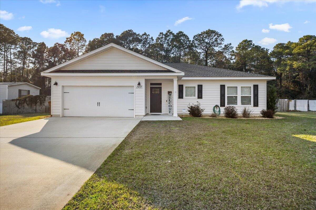 No HOA, 2.25% assumable VA loan and proven short-term rental income!! This 3-bedroom, 2-bathroom, 1,550 sq. ft. home is less than 6 miles from Navarre Beach, offering easy access to white sand, clear waters, and the Navarre Beach Fishing Pier. The open floor plan features high ceilings, modern finishes, and plenty of natural light. The kitchen boasts stainless steel appliances, sleek countertops, and a large island. The primary suite includes an en-suite bath and walk-in closet. Enjoy a large, privately fenced backyard, perfect for relaxing. Conveniently located near waterfront dining, parks, and shopping.Make this your primary residence, vacation getaway, or an investment with a proven rental history!