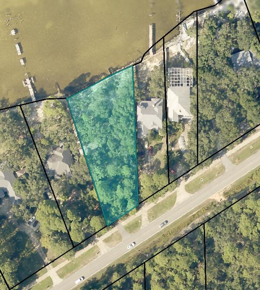 Beautiful bay front view on this amazing piece of land that has 147' of waterfront. This property has beautiful live oak trees and a seawall with riprap. Property is located off of a paved county road and includes a sidewalk at the entrance. Enjoy your morning and evenings overlooking your waterfront view and strolls down East Bay along the sidewalk. This land is vacant and can be viewed at any time without having to inquire a date and time.